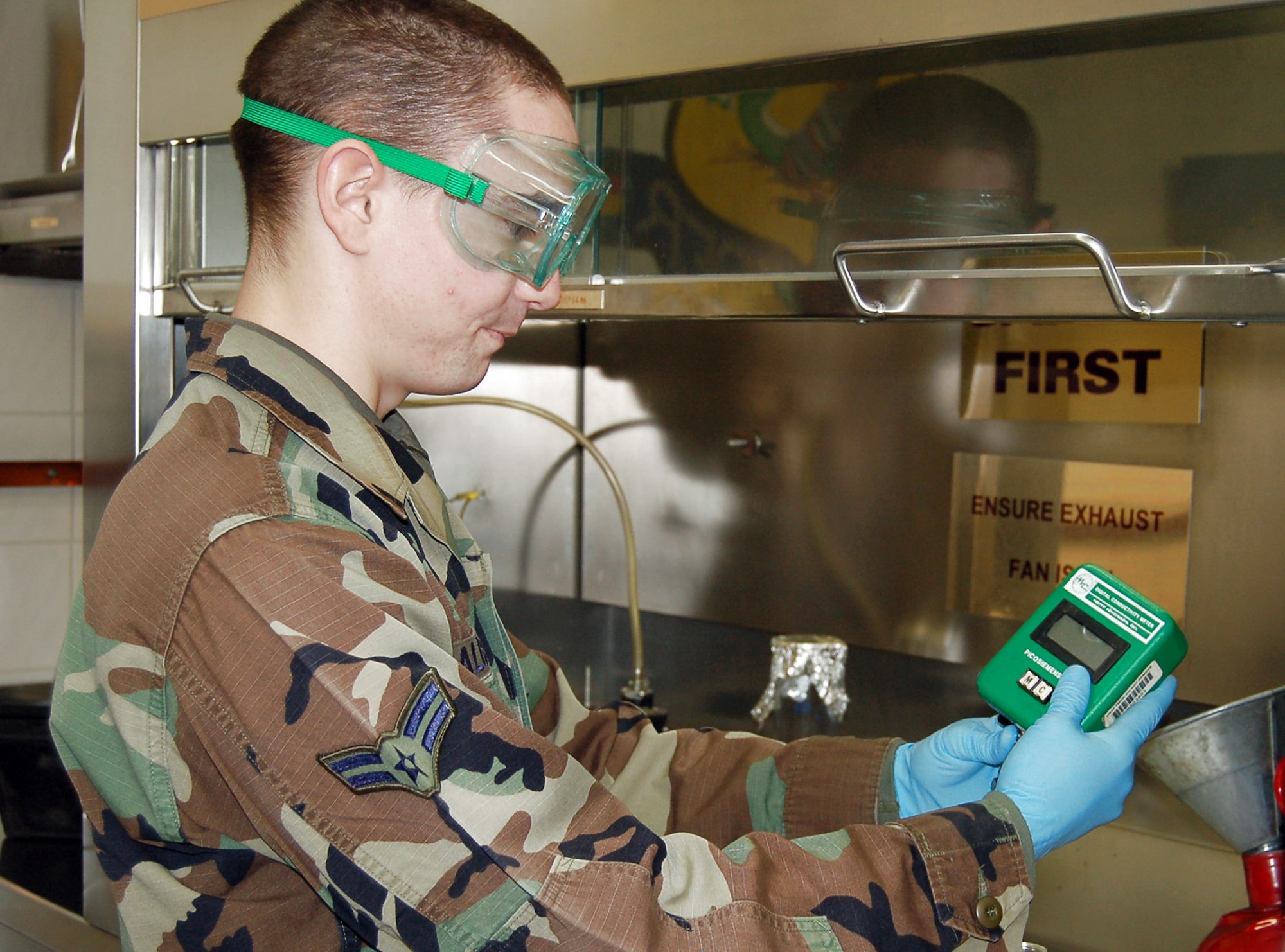 Airman 1st Class Darren Albrecht checks the conductivity additive level in a fuel sample at Spangdahlem Air Base, Germany. The additive decreases the conductivity of the fuel making it safer to handle. Airman Albrecht is a 52nd Logistics Readiness Squadron fuel laboratory technician. (U.S. Air Force photo/Staff Sgt. Tammie Moore) 
