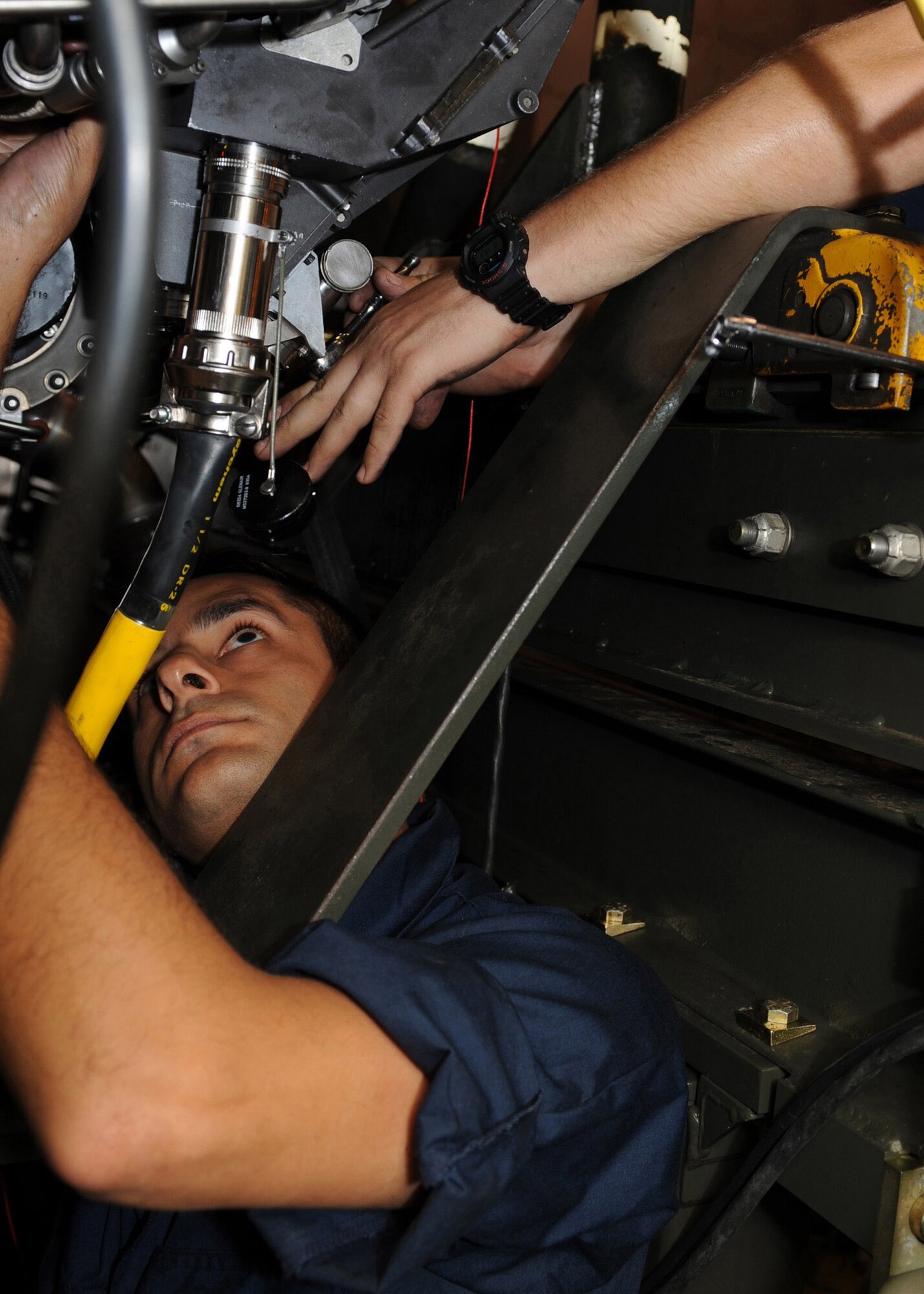 Senior Airman Shaan Kashyap installs the mount bolts of an engine diagnostics unit at Seymour Johnson Air Force Base, N.C., May 21. Airman Kashyap is responsible for running ground, which means to check for damage or mishaps while the engine is running. Airman Kashyap is assigned to the 4th Component Maintenance Squadron as an aerospace propulsion specialist, (U.S. Air Force photo/Airman 1st Class Salma Nebot) 