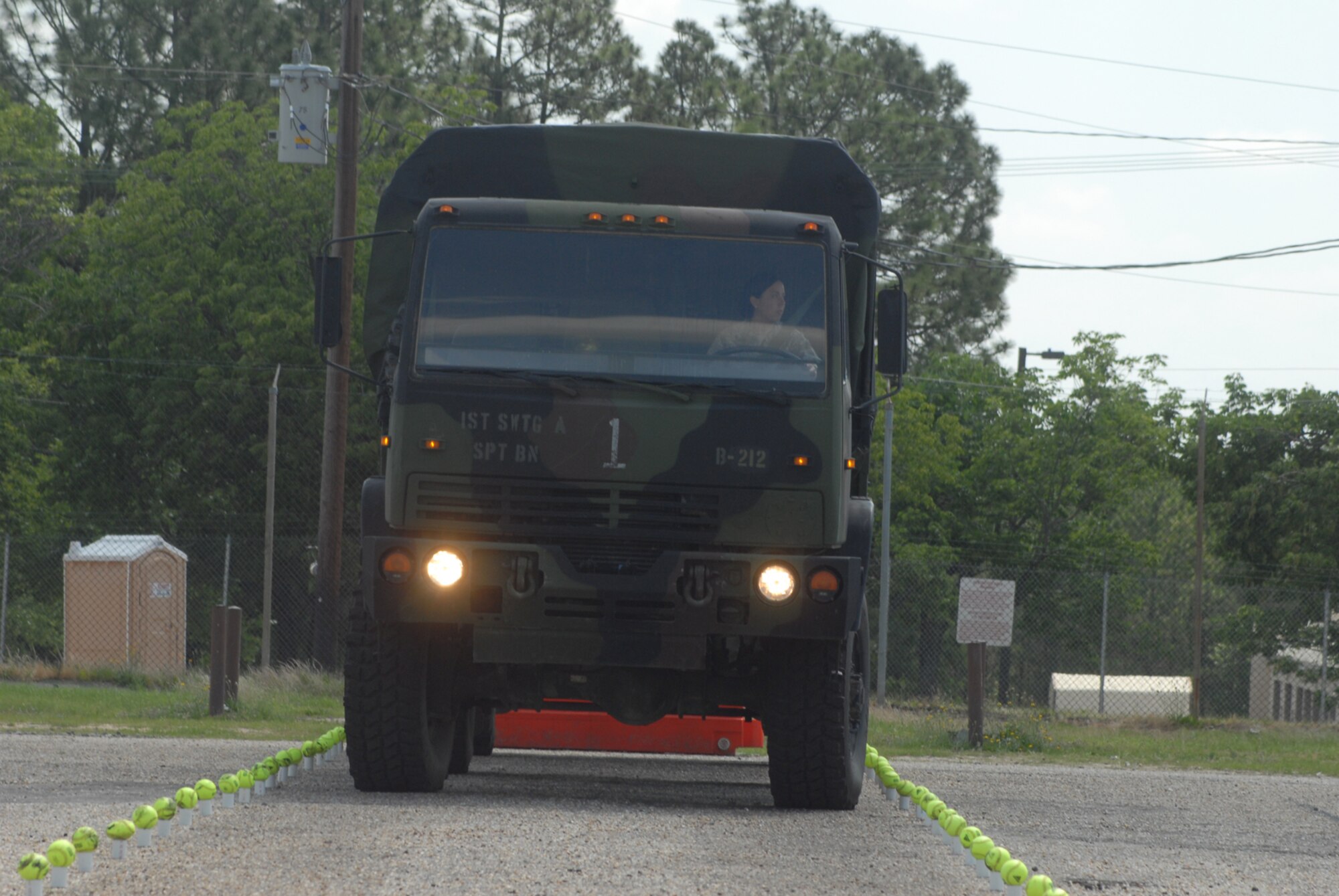 Staff Sgt. Melissa Kelley, 43rd Logistics Readiness Squadron, maneuvers an Army M-1072 with trailer during the Straight-Line Backing event during a vehicle Rodeo competition May 30 at the Fort Bragg Fair Grounds. Six members from the 43rd Logistics Readiness Squadron were invited to participate in the Rodeo’s six events. (U.S. Air Force Photo by Airman 1st Class Mindy Bloem)