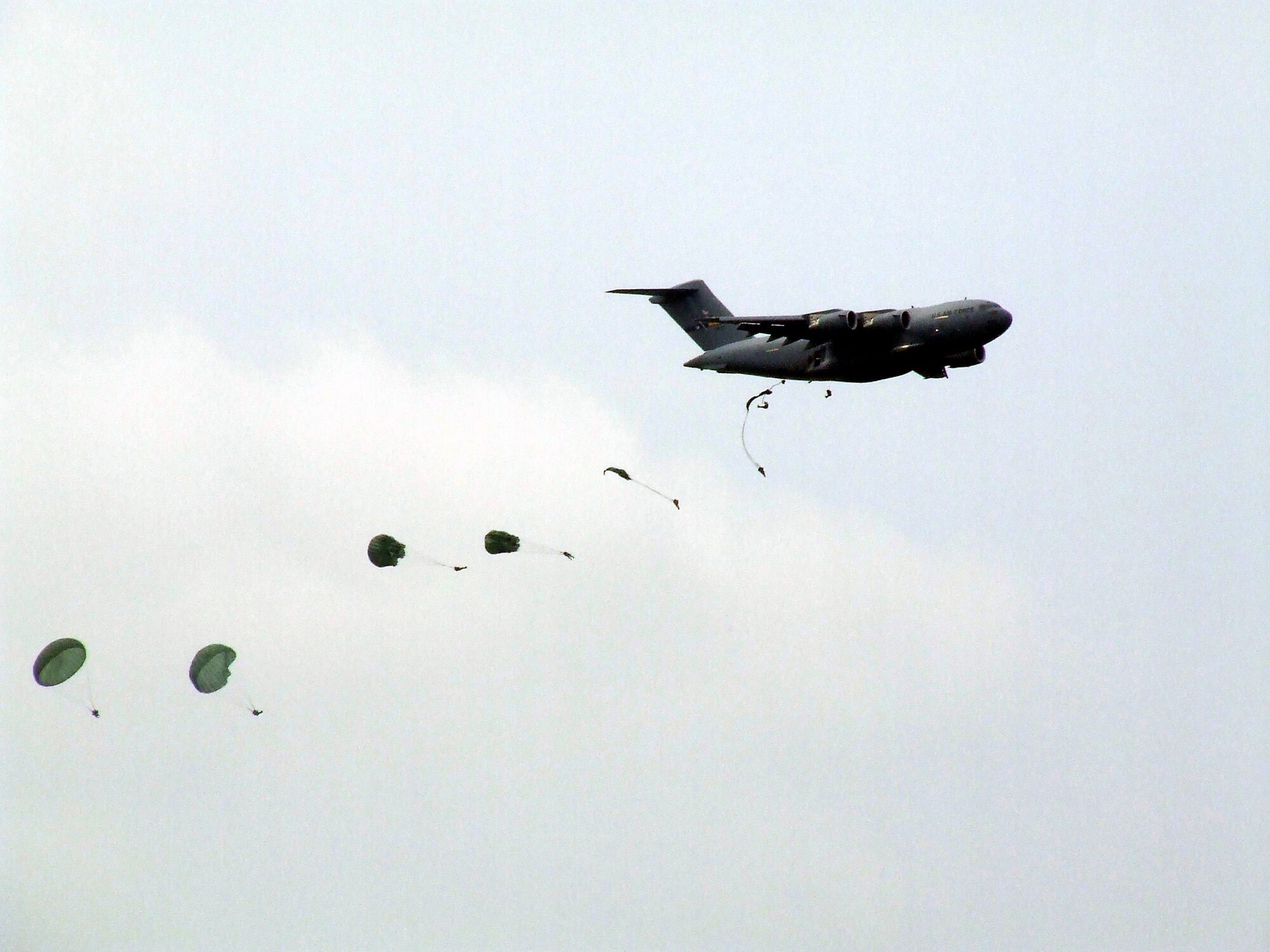 Paratroopers from the U.S. Army's 82nd Airborne Division jump from a McGuire Air Force Base, N.J., C-17 Globemaster III during an event for McGuire Air Expo 2008 May 31.  The expo drew more than 170,000 visitors over two days and it was the culminating event for Air Force Week in Philadelphia.  (U.S. Air Force Photo/Tech. Sgt. Scott T. Sturkol)