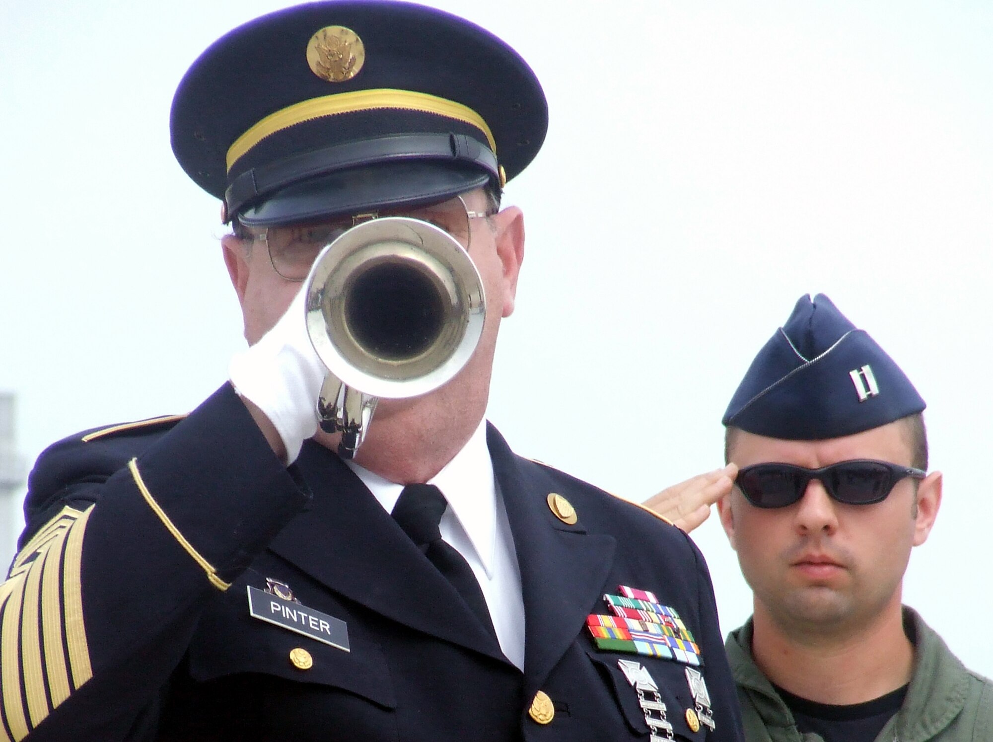 Retired Army First Sgt. Richard Pinter, a 67-year-old Bordentown Township, N.J., resident, plays "Taps" during a wreath-laying ceremony at the McGuire Air Force Base, N.J., Air Expo May 31, 2008.  Sergeant Pinter, known as the "Lone Bugler," plays the bugle in many New Jersey patriotic observances.  The Air Expo was the culminating event for Air Force Week in Philadelphia.  More than 170,000 people attended the expo. (U.S. Air Force Photo/Tech. Sgt. Scott T. Sturkol)