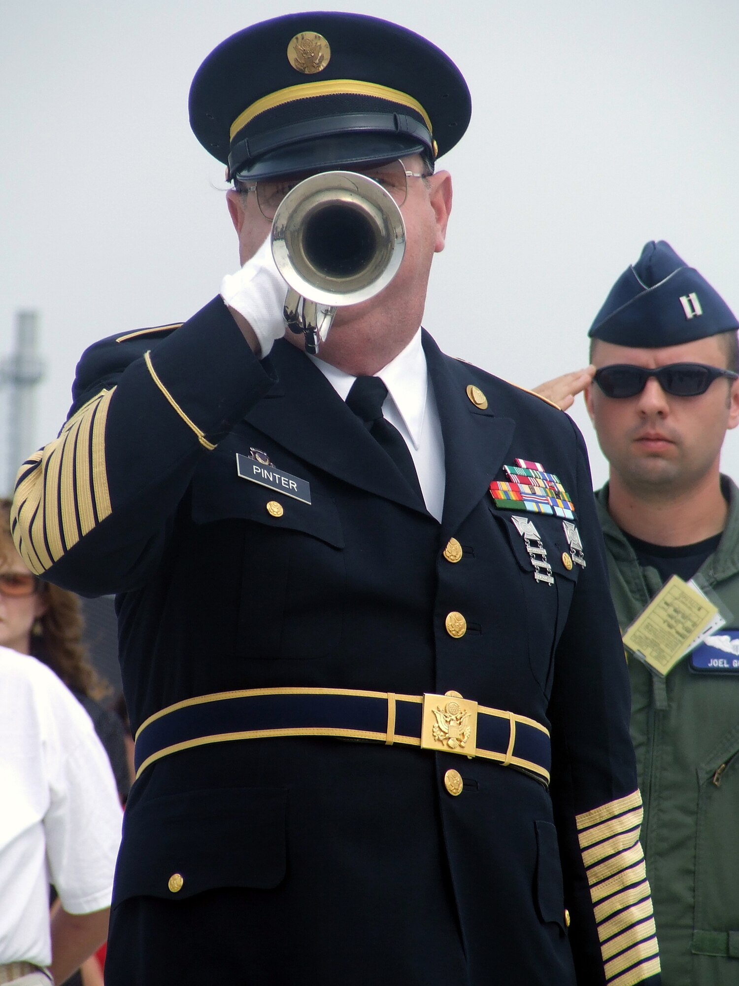 Retired Army First Sgt. Richard Pinter, a 67-year-old Bordentown Township, N.J., resident, plays "Taps" during a wreath-laying ceremony at the McGuire Air Force Base, N.J., Air Expo May 31, 2008.  Sergeant Pinter, known as the "Lone Bugler," plays the bugle in many New Jersey patriotic observances.  The Air Expo was the culminating event for Air Force Week in Philadelphia.  More than 170,000 people attended the expo. (U.S. Air Force Photo/Tech. Sgt. Scott T. Sturkol)