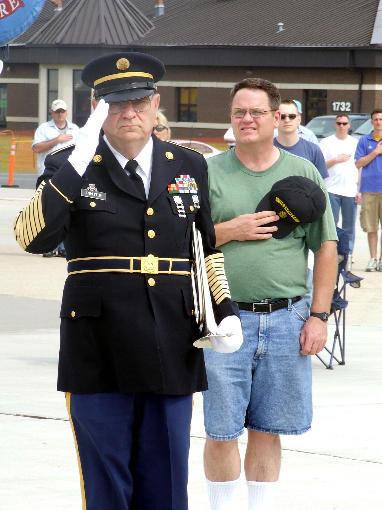 Retired Army First Sgt. Richard Pinter, a 67-year-old Bordentown Township, N.J., resident, salutes during the singing of the national anthem during a wreath-laying ceremony at the McGuire Air Force Base, N.J., Air Expo May 31, 2008.  Sergeant Pinter, known as the "Lone Bugler," played "Taps" at the end of the ceremony.  The Air Expo was the culminating event for Air Force Week in Philadelphia.  More than 170,000 people attended the expo. (U.S. Air Force Photo/Tech. Sgt. Scott T. Sturkol)