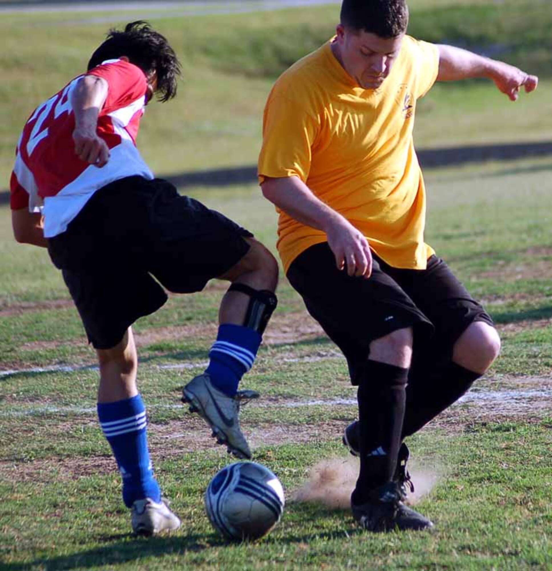 SPIRIT striker Hien Huynh, left, battles for the ball with 965th Airborne Air Control Squadron fullback Daniel lNibbelink in the first half of a 20089 intramural soccer playoff game at the tinker Sports Complex on May 23.  SPIRIT won the game 3-2.  (Air Force photo by John E. Banks)