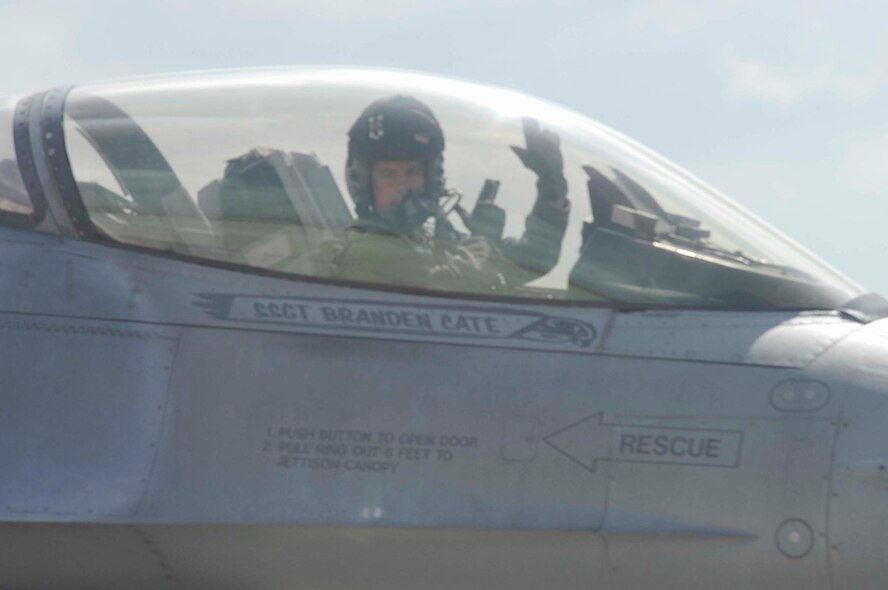 SHAW AIR FORCE BASE, S.C. -- Capt. Zachary Counts, 55th Fighter Squadron pilot, gives the "shooters" signal before take-off May 9. More than 125 Airmen and approximately 10 F-16s from the 55th Fighter Squadron are participating in a multinational exercise called Red Flag, which is hosted at Eielson AFB, Alaska, from June 3 -21. Red Flag was developed to simulate the tactics and stresses of combat as closely as possible. (U.S. Air Force photo/Staff Sgt. Nathan Bevier)