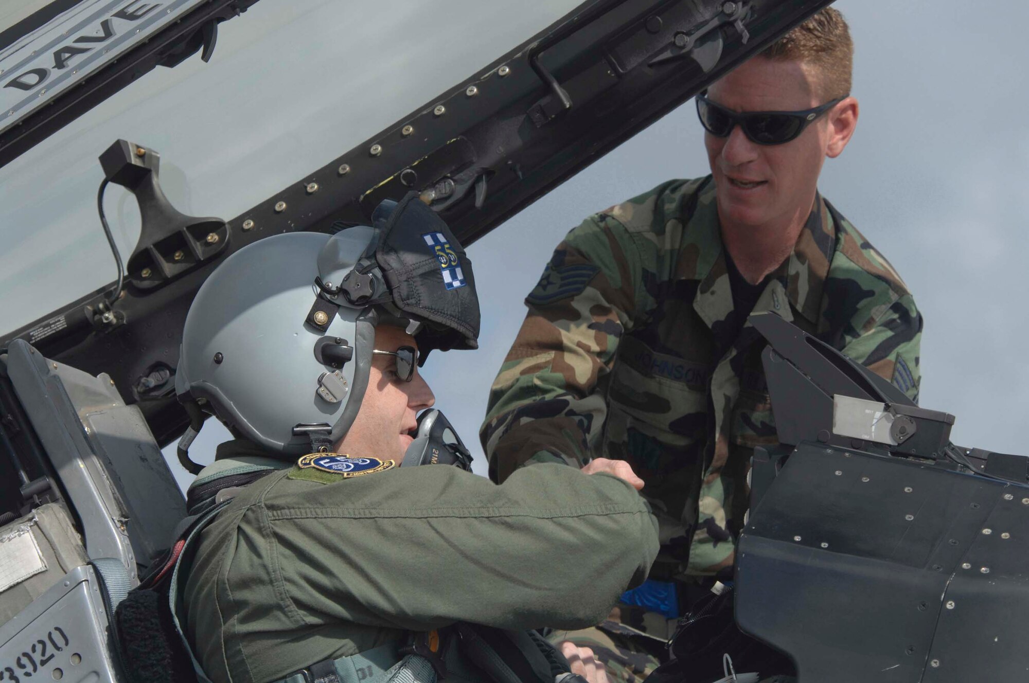 SHAW AIR FORCE BASE, S.C. -- Lt. Col. Miles "Quatro" Demayo, 55th Fighter Squadron commander, shakes hands with Staff Sgt. Brett Johnson, 55th Fighter Squadron crew chief, before closing the canopy of the F-16 May 9. More than 125 Airmen and approximately 10 F-16s from the 55th Fighter Squadron are participating in a multinational exercise called Red Flag, which is hosted at Eielson AFB, Alaska, from June 3 -21. Red Flag was developed to simulate the tactics and stresses of combat as closely as possible. (U.S. Air Force photo/Staff Sgt. Nathan Bevier)