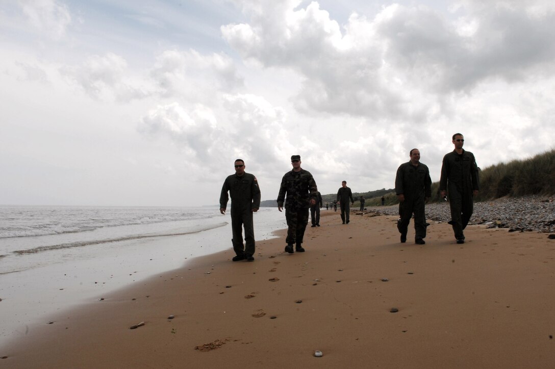 Airmen walk along Omaha Beach as part of the weeklong commemoration of the D-Day invasion June 5 in Normandy, France. More than more than 9,000 allied soldiers were killed or wounded on this 50-mile stretch of beach, but it marked the beginning of the end of Nazi Germany during World War II. (U.S. Air Force photo/Airman 1st Class Amber Bressler) 