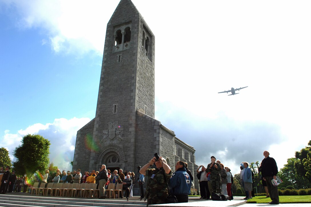 A C-130 Hercules flies over the Brittany American Cemetery June 4 in Normandy France. More than 4,000 American casualties of World War II are buried at this cemetery. The C-130 is from the 37th Airlift Squadron at Ramstein Air Base, Germany. (U.S. Air Force photo/Airman 1st Class Amber Bressler) 

