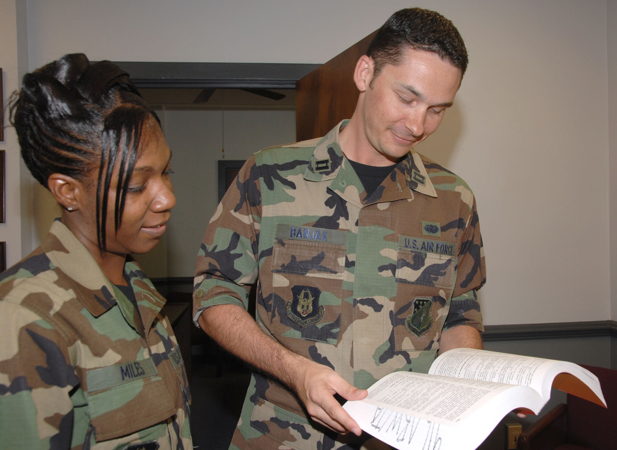 SEYMOUR JOHNSON AIR FORCE BASE, N.C. -- Capt. Marc Banjak, deputy staff judge advocate, reviews some legal paperwork with a Reservist of the 916th ARW. U.S. Air Force photo/TSgt. Gillian Albro