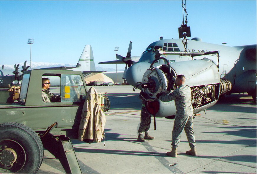 (Left) Tech. Sgt. Mike Brumer, a Senior Munitions Inspector with Nashville’s 118th Fight Wing, operates a crane during an engine change on a C-130 at Bagram Air Base during a recent deployment to Afghanistan. He is Aerospace Testing Alliance’s Hazardous Material Operations Manager for the Arnold Engineering Development Center in middle Tennessee. (Photo provided)