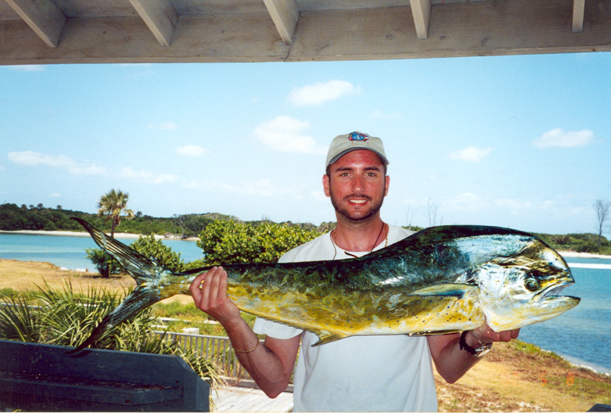 Arnold Engineering Development Center's (AEDC) Mike Brumer holds up a 22-pound dolphin fish he caught off the coast of Jupiter, Fla., in 2005. He is Aerospace Testing Alliance’s (ATA) Hazardous Material Operations Manager for the base, ATA is the support contractor for AEDC. (Photo provided) 