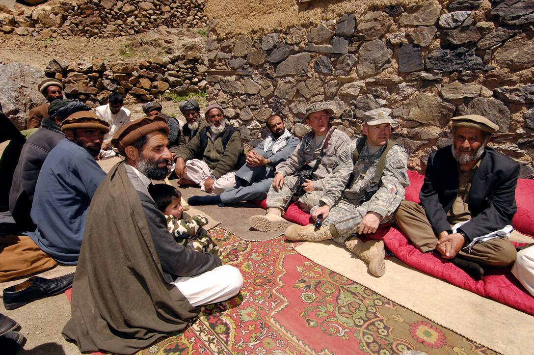 In the Panjshir Province, Afghanistan, elders meet May 29 with Capt. Glenn Little (left) and Maj. Nicholas Dickson from two reconstruction teams about a local medical visit.  (U.S. Air Force photo/Master Sgt. Demetrius Lester)
