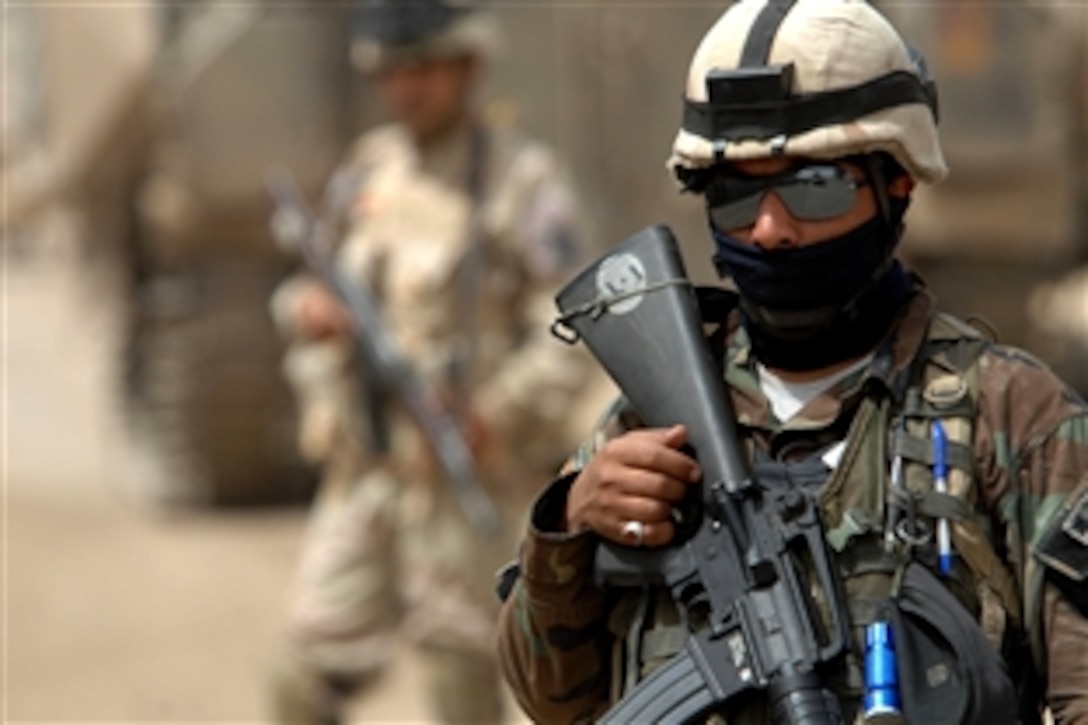 U.S. and Iraqi soldiers conduct a joint patrol in Jameela Market in the Sadr City district of Baghdad, June 2, 2008. The U.S. soldiers are assigned to Company C, 1st Brigade, 6th Infantry, and the Iraqi soldiers are assigned to the 3rd Battalion, 42nd Brigade, 11th Division Iraqi Army.


