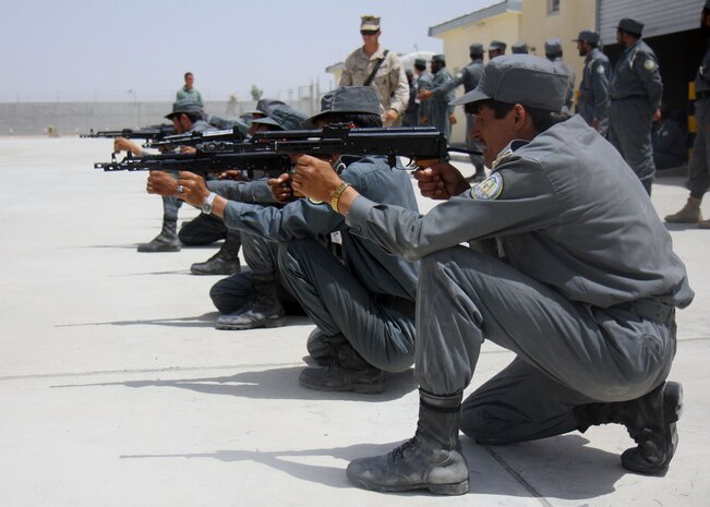 Afghan National Police Recruits, trained by 2nd Battalion, 7th Marine Regiment, practice sighting in with their AMD-65 at Lashkar Gah, June 7. 2nd Battalion 7th Marines, based out of Marine Air Ground Combat Center 29 Palms, is a reinforced light infantry battalion deployed to Afghanistan in support of Operation Enduring Freedom.