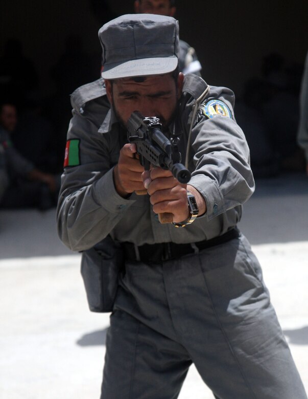 An Afghan National Police Recruit, trained by 2nd Battalion, 7th Marine Regiment, practices sighting in with his AMD-65 at Lashkar Gah on June 7.