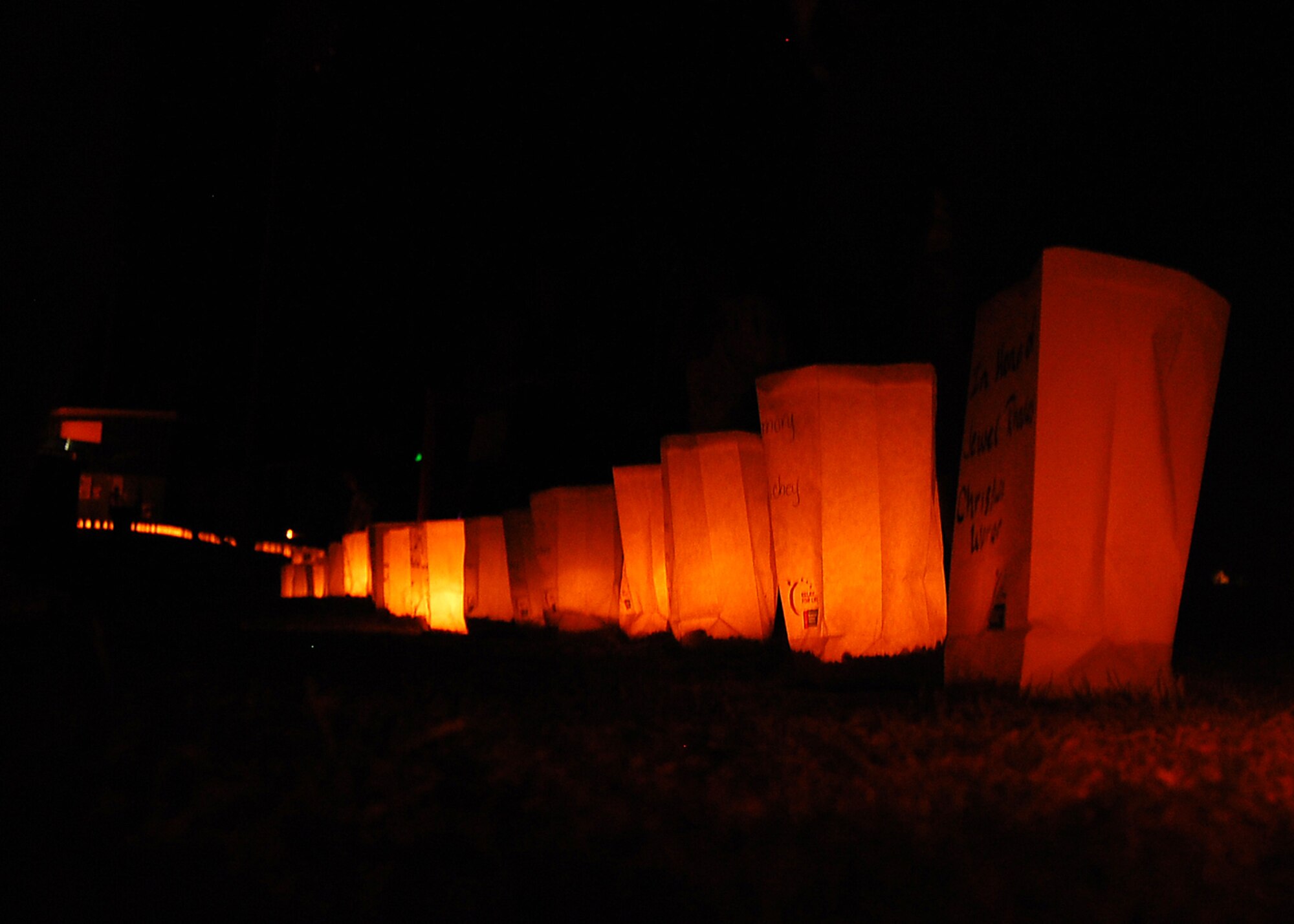 Luminaries are placed around the track in honor of people who are battling cancer or have died of cancer at the  American Cancer Society's Relay For Life in Alamogordo, N.M., the evening of June 7. Members of Team Holloman and residents from Alamogordo paticipated in Relay For Life to pay tribute to the lives lost to the disease, and raise money. (U.S. Air Force photo/Airman 1st Class Michael Means)