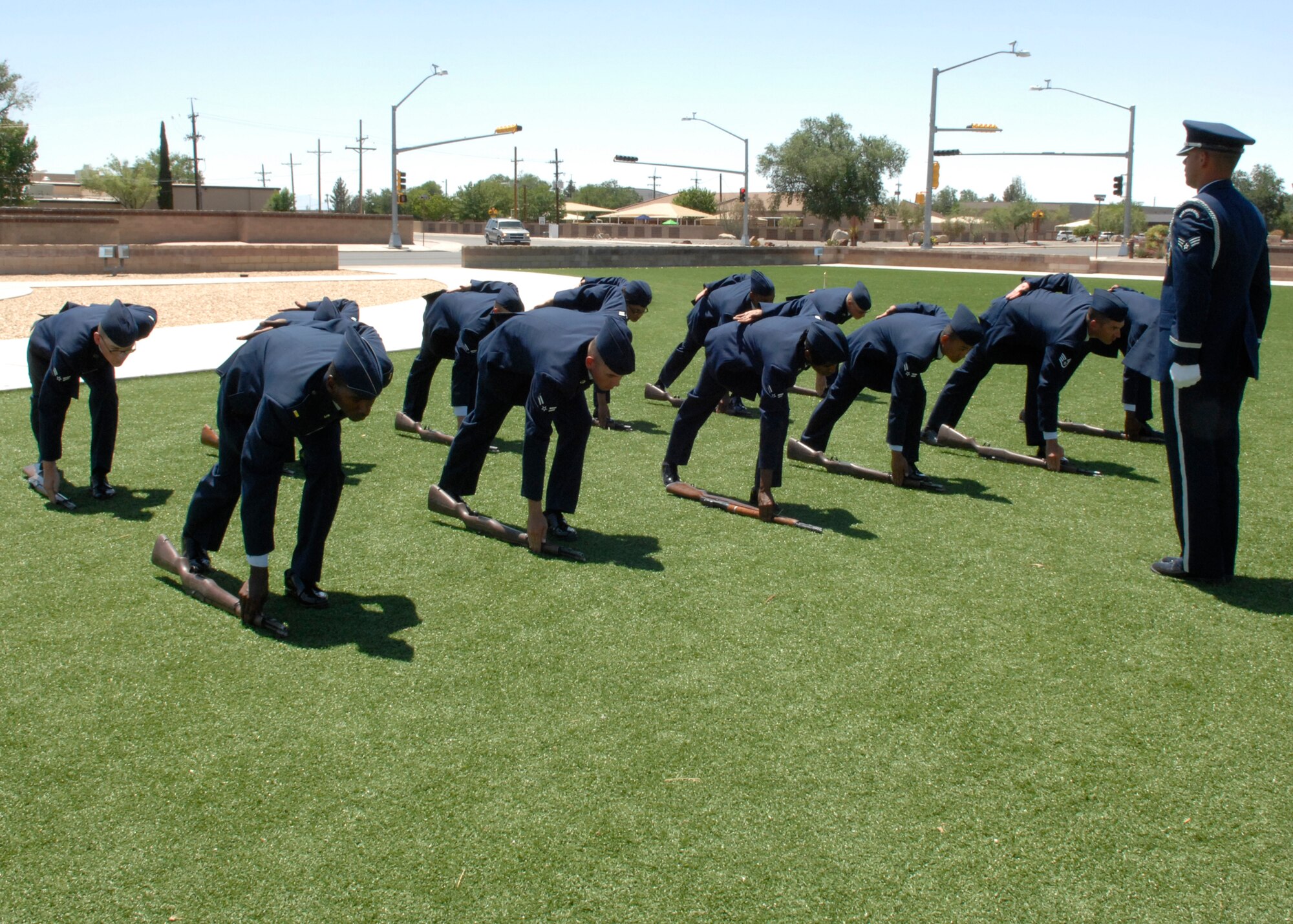 The newest members of the Steel Talons Honor Guard show off their skills during their graduation ceremony, June 3 at Heritage Park on Holloman Air Force Base,N.M. Every quarter a new Honor Guard class graduates. (U.S. Air Force photo/Airman 1st Class Rachel A. Kocin)