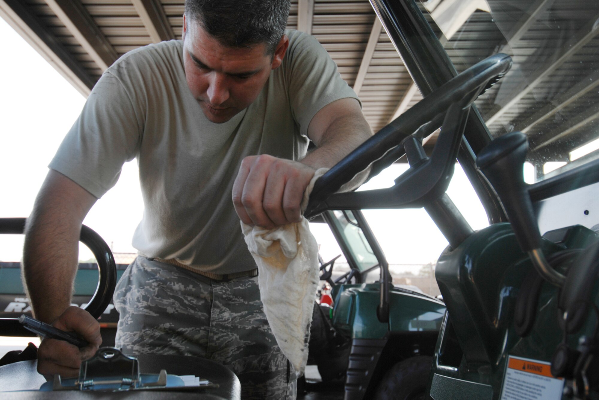 MOODY AIR FORCE BASE, Ga. - During the 23rd Logistics Readiness Squadron base-wide inspection of all Other Government Motor Vehicle Conveyances (OMGVC) on June 5, vehicle maintenance mechanic Tech. Sgt. Brian Howard inspects a Kawasaki Mule as part of the first ever inspection on this scale.  Mules and Polaris vehicles are only two varieties of the utility vehicles covered in this inspection. (U.S. Air Force photo/Staff Sgt. Joshua T. Jasper)