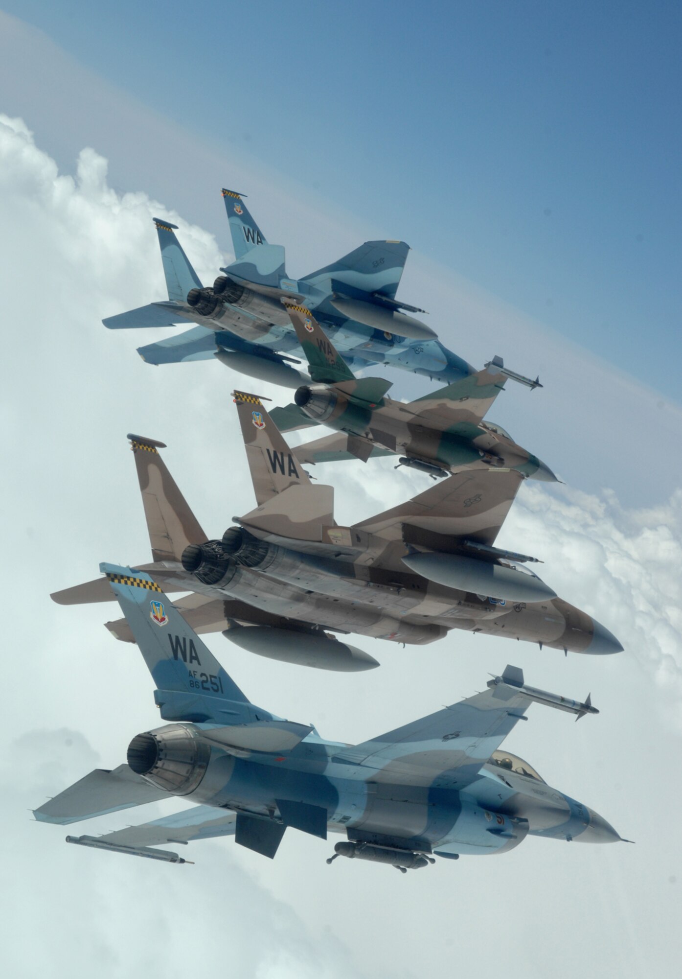 A flight of Aggressor F-15 Eagles and F-16 Fighting Falcons fly in formation over the Nevada Test and Training Ranges on June 5, 2008. The jets are assigned to the 64th and 65th Aggressor Squadrons at Nellis Air Force Base, Nev. The Aggressor mission is to prepare the combat air forces, joint and allied aircrews for tomorrowÕs victories with challenging and realistic threat replication, training, academics and feedback.
(U.S. Air Force photo/ Master Sgt. Kevin J. Gruenwald)