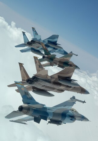 A flight of Aggressor F-15 Eagles and F-16 Fighting Falcons fly in formation over the Nevada Test and Training Ranges on June 5, 2008. The jets are assigned to the 64th and 65th Aggressor Squadrons at Nellis Air Force Base, Nev. The Aggressor mission is to prepare the combat air forces, joint and allied aircrews for tomorrowÕs victories with challenging and realistic threat replication, training, academics and feedback.
(U.S. Air Force photo/ Master Sgt. Kevin J. Gruenwald)
