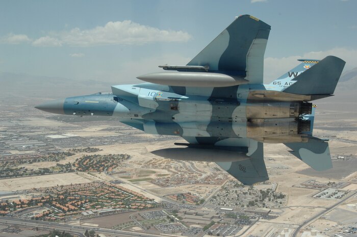An Aggressor F-15 Eagle flys across the Nevada Test and Training Ranges June 5, 2008. The jet is assigned to the 64th and 65th Aggressor Squadrons at Nellis Air Force Base, Nev. The Aggressor mission is to prepare the combat air forces, joint and allied aircrews for tomorrowÕs victories with challenging and realistic threat replication, training, academics and feedback.
(U.S. Air Force photo/ Master Sgt. Kevin J. Gruenwald) 
