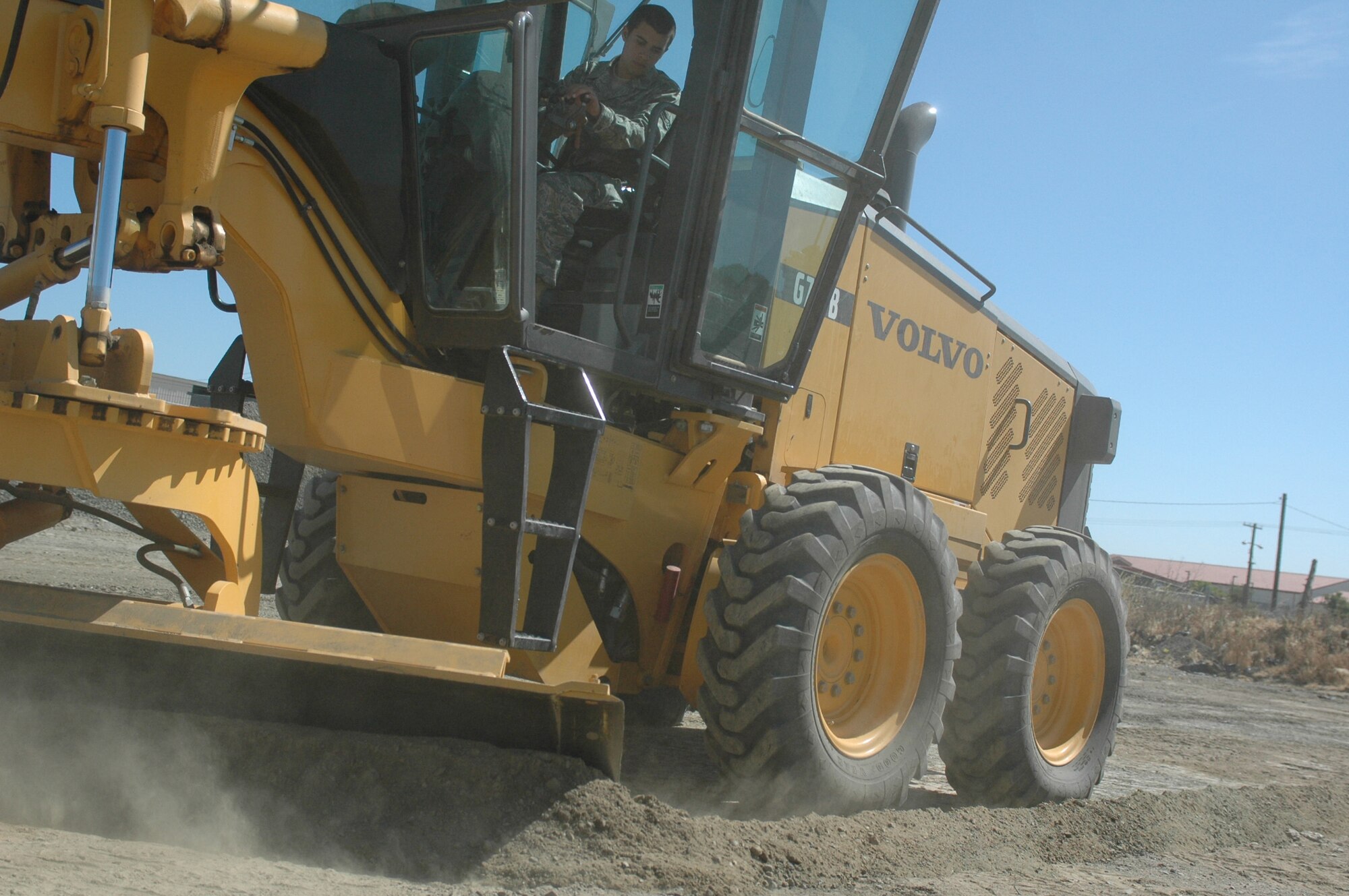Airman 1st Class Elgrad Lafferty, 60th Civil Engineering Squadron heavy equipment operator, gets training on a grader. The training will prepare Airman Lafferty for work that needs to be accomplished during a deployment. (U.S. Air Force photo/Senior Airman Shaun Emery)
 
