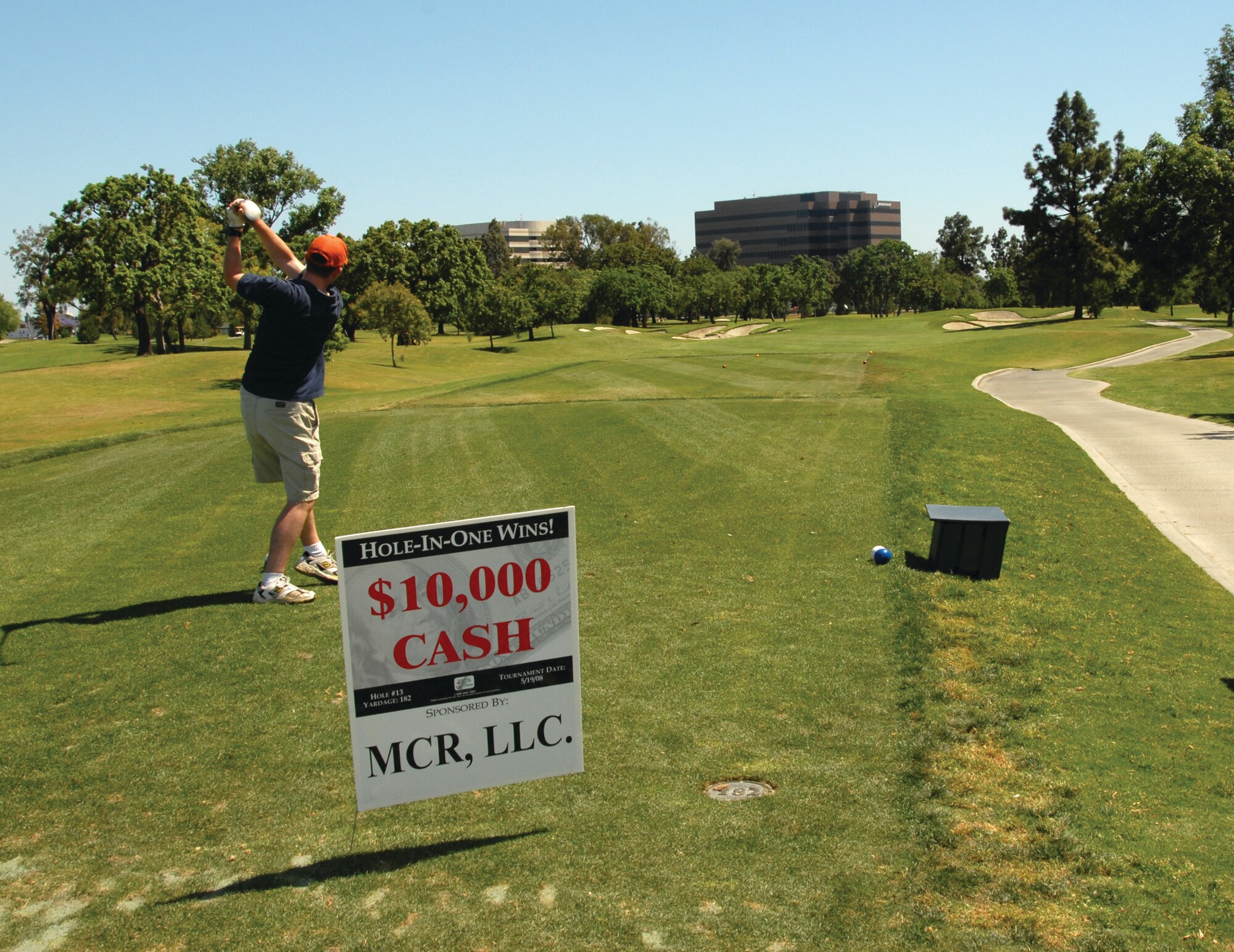 A participant demonstrates his tee drive at the $10,000 hole-in-one sponored by MCR Inc. during the GPS Partnership Council golf tournament. (photo by Joe Juarez)
