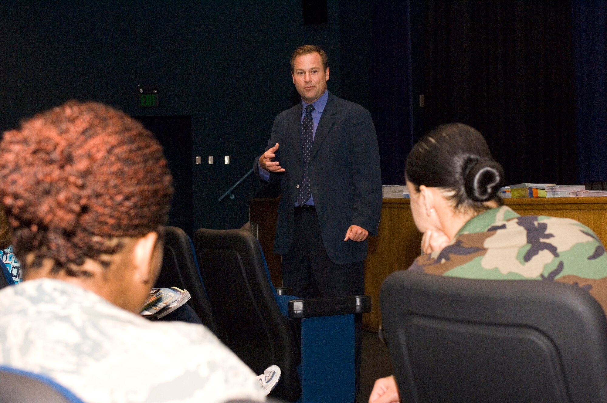 LANGLEY AIR FORCE BASE, Va. -- John Cash, WAVY News 10, meteorologist, speaks to Langley personnel at a hurricane preparedness workshop at the base theatre June 6.  The workshop was designed to help people mentally and financially prepare for hurricane evacuation.  (U.S. Air Force photo/Senior Airman Barry Loo)