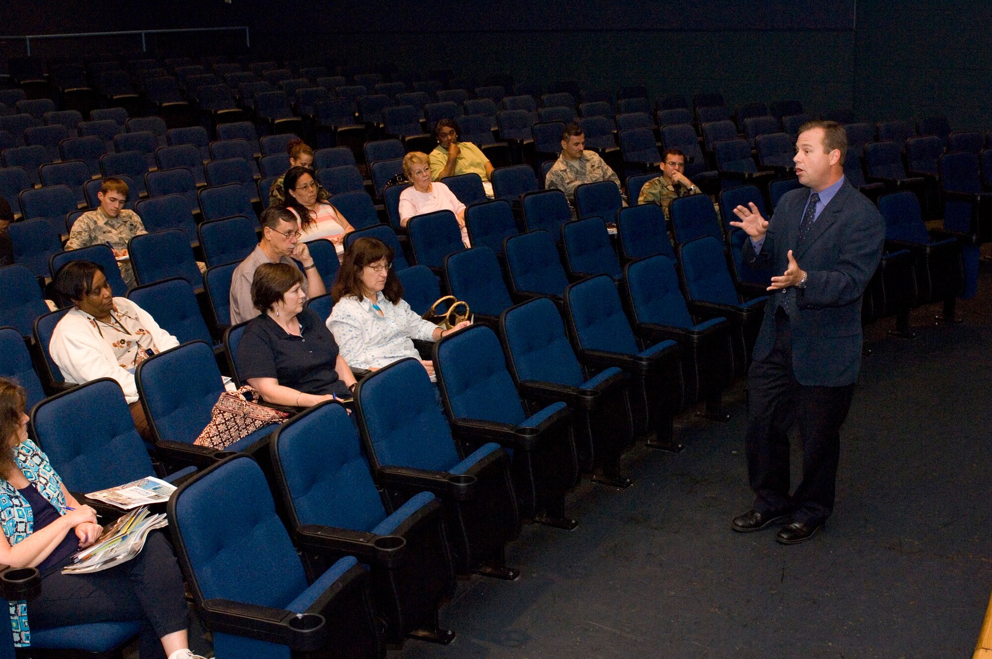 LANGLEY AIR FORCE BASE, Va. -- John Cash, WAVY News 10 meteorologist, speaks to Langley personnel at a hurricane preparedness workshop at the base theatre June 6.  The workshop was designed to help people mentally and financially prepare for hurricane evacuation.  (U.S. Air Force photo/Senior Airman Barry Loo)