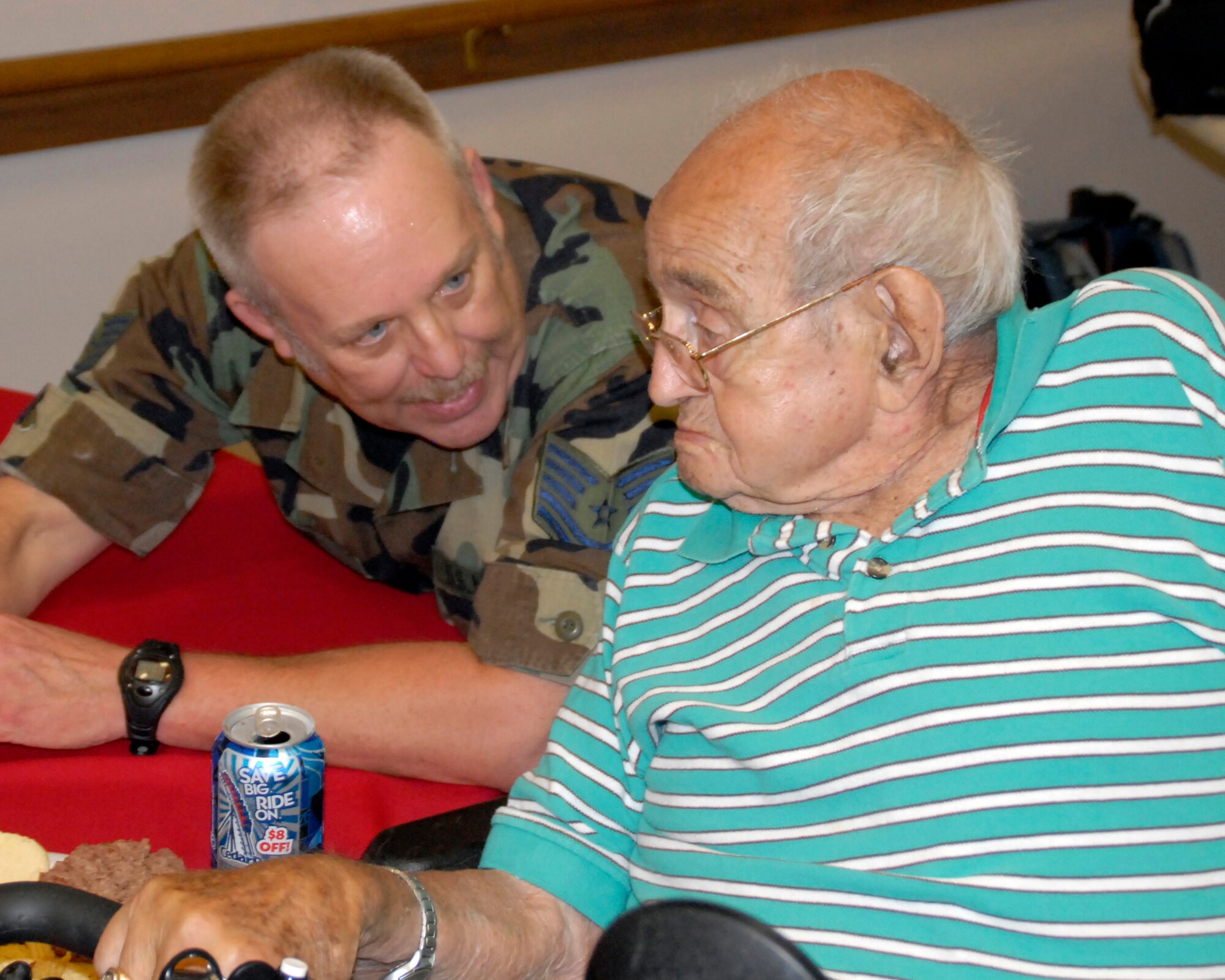 WRIGHT-PATTERSON AFB, Ohio - Tech. Sgt. Mike Lane, 445th Maintenance Squadron, talks with VA resident Walter Ellison during the annual Air Force Sergeant's Association picnic June, 7, 2008, at the Veterans Affairs Medical Center in Dayton, Ohio.  Reservists from the 445th Airlift wing support the event every year and enjoy hearing and sharing stories with the VA residents. (U.S. Air Force photo/Tech. Sgt. Charlie Miller)