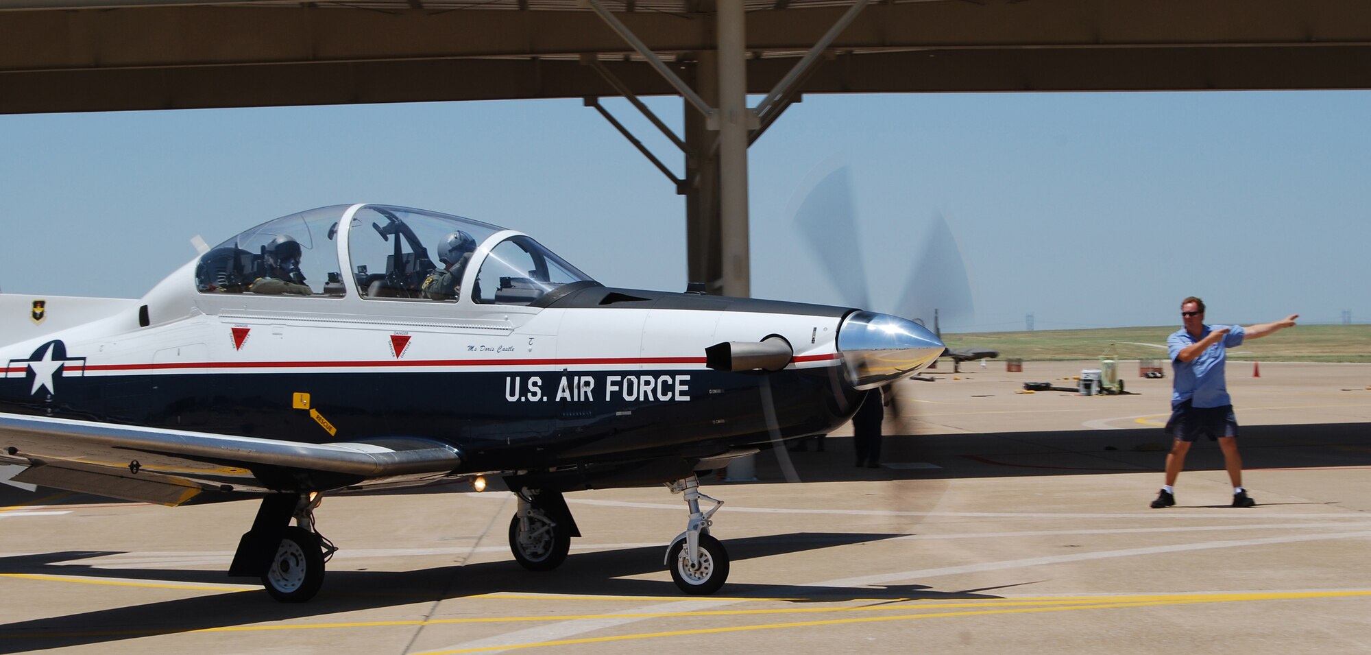 A T-6A Texan II taxis out for takeoff June 4 carrying 80th Flying Training Wing Commander Col. David Petersen, front seat, and the wing's honorary commander Lanham Lyne. The wing treated it's honorary commander to an orientation flight in its newest trainer aircraft to give Mr. Lyne and inside look at the wing's mission. (U.S. Air Force photo/John Ingle)