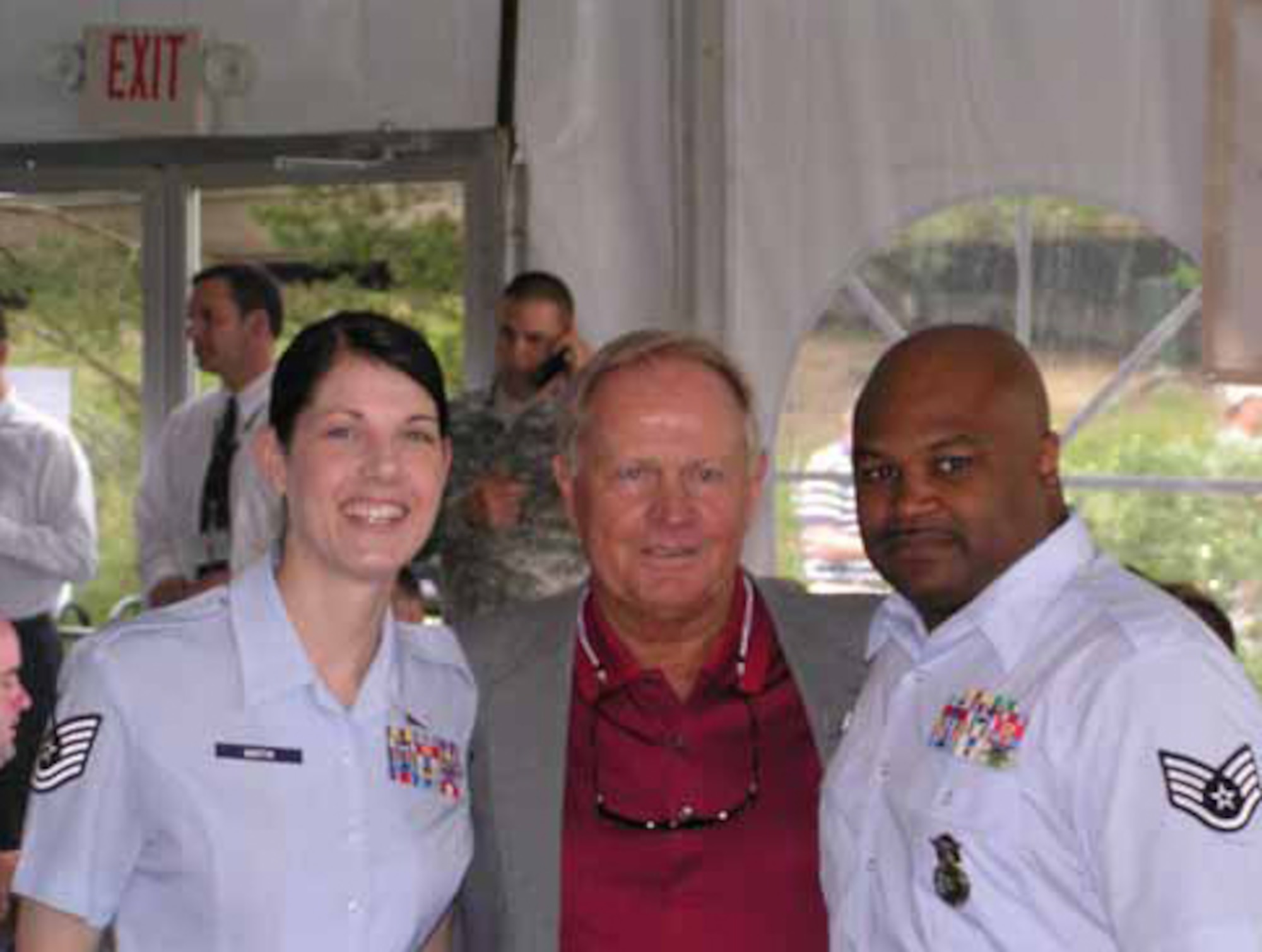 Tech. Sgt. Christine Martin from Finance, left, and Staff Sgt. Jeffrey Roberts,
right, from Security Forces Squadron were with golf legend Jack Nicklaus at
the 2008 Memorial Golf Tournament’s “Military Appreciation Day.