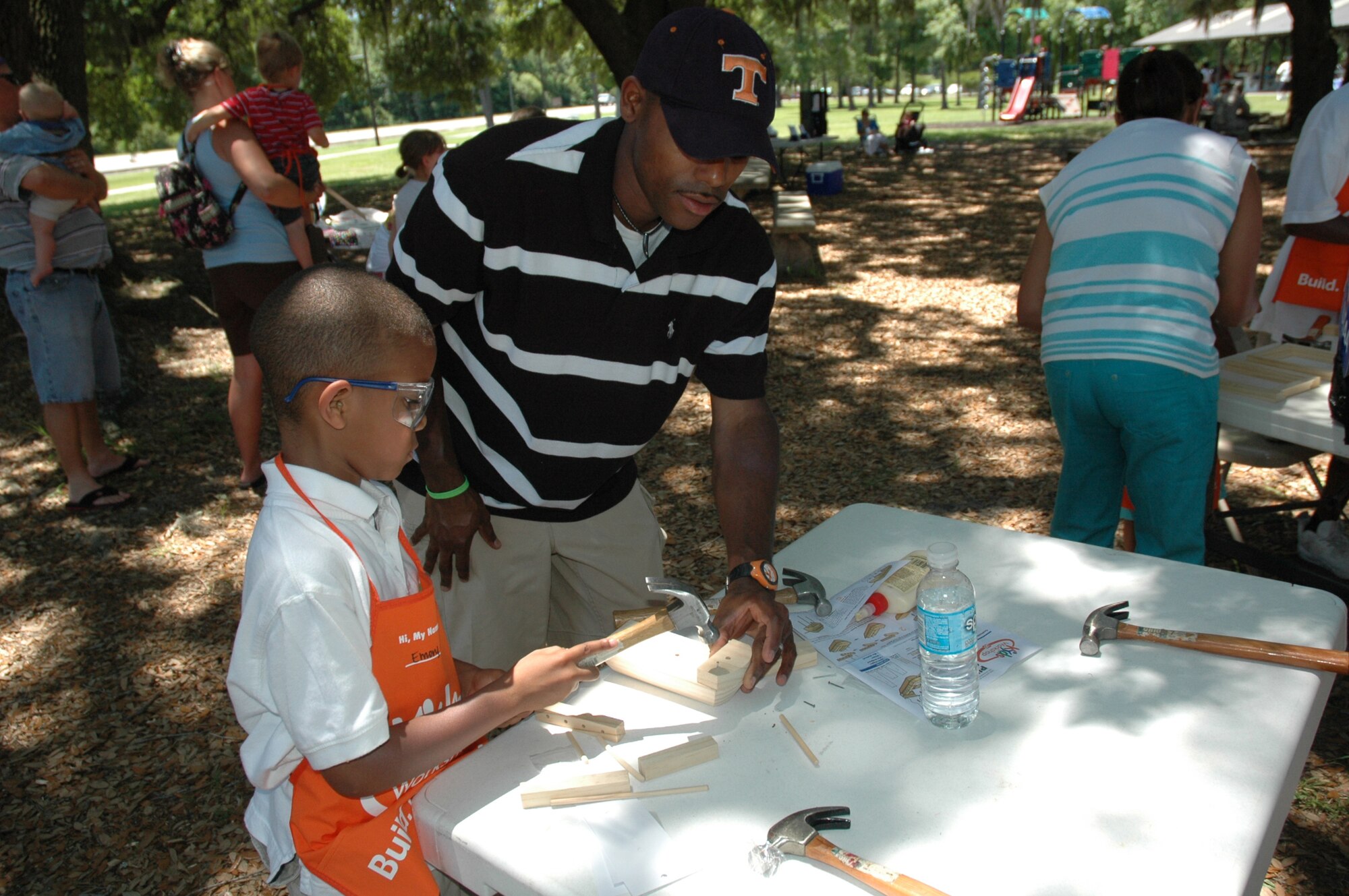 The annual 315th Airlift Wing base picnic was held at Charleston Air Force Base Saturday from 11 a.m. to 4 p.m. The event was a fun time for every member of the 315th reserve family with food for all, a boat load of cold beverages to help hold off the heat, and plenty of activities for the kiddies including: jump castles, a blow-up obstacle course, a twirling fair ride, face painting as well as playground equipment. Home Depot came out to support the troops and set up Do-It-Yourself craft tables where reservists and their children were able to build small projects together. Several reservists even brought out the family pet for the occasion.  (U.S. Air Force Photos by Senior Airman Dani Pacheco)