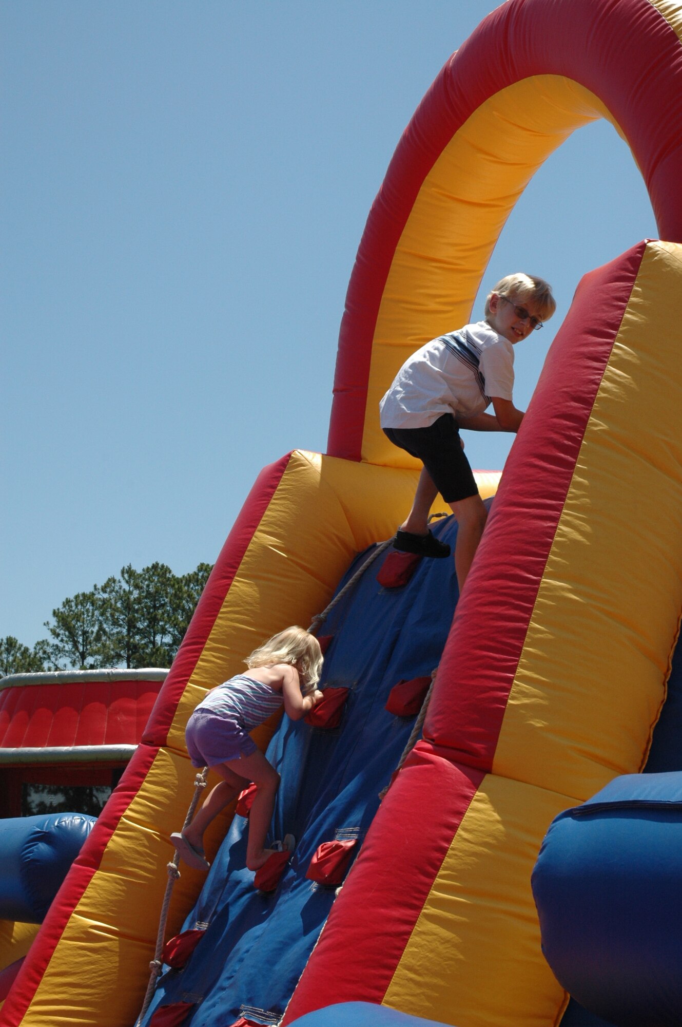 The annual 315th Airlift Wing base picnic was held at Charleston Air Force Base Saturday from 11 a.m. to 4 p.m. The event was a fun time for every member of the 315th reserve family with food for all, a boat load of cold beverages to help hold off the heat, and plenty of activities for the kiddies including: jump castles, a blow-up obstacle course, a twirling fair ride, face painting as well as playground equipment. Home Depot came out to support the troops and set up Do-It-Yourself craft tables where reservists and their children were able to build small projects together. Several reservists even brought out the family pet for the occasion.  (U.S. Air Force Photos by Senior Airman Dani Pacheco)