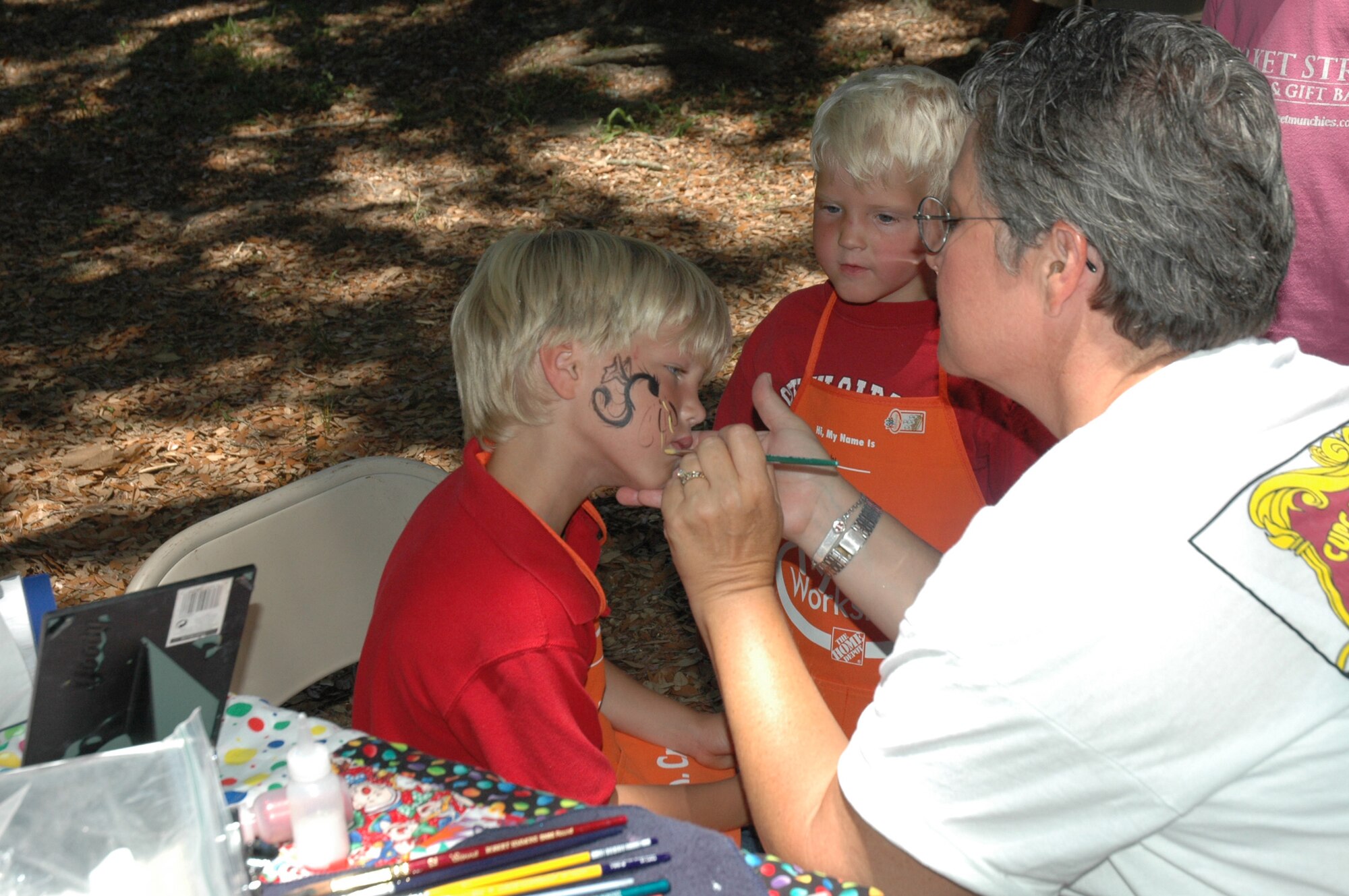 The annual 315th Airlift Wing base picnic was held at Charleston Air Force Base Saturday from 11 a.m. to 4 p.m. The event was a fun time for every member of the 315th reserve family with food for all, a boat load of cold beverages to help hold off the heat, and plenty of activities for the kiddies including: jump castles, a blow-up obstacle course, a twirling fair ride, face painting as well as playground equipment. Home Depot came out to support the troops and set up Do-It-Yourself craft tables where reservists and their children were able to build small projects together. Several reservists even brought out the family pet for the occasion.  (U.S. Air Force Photos by Senior Airman Dani Pacheco)