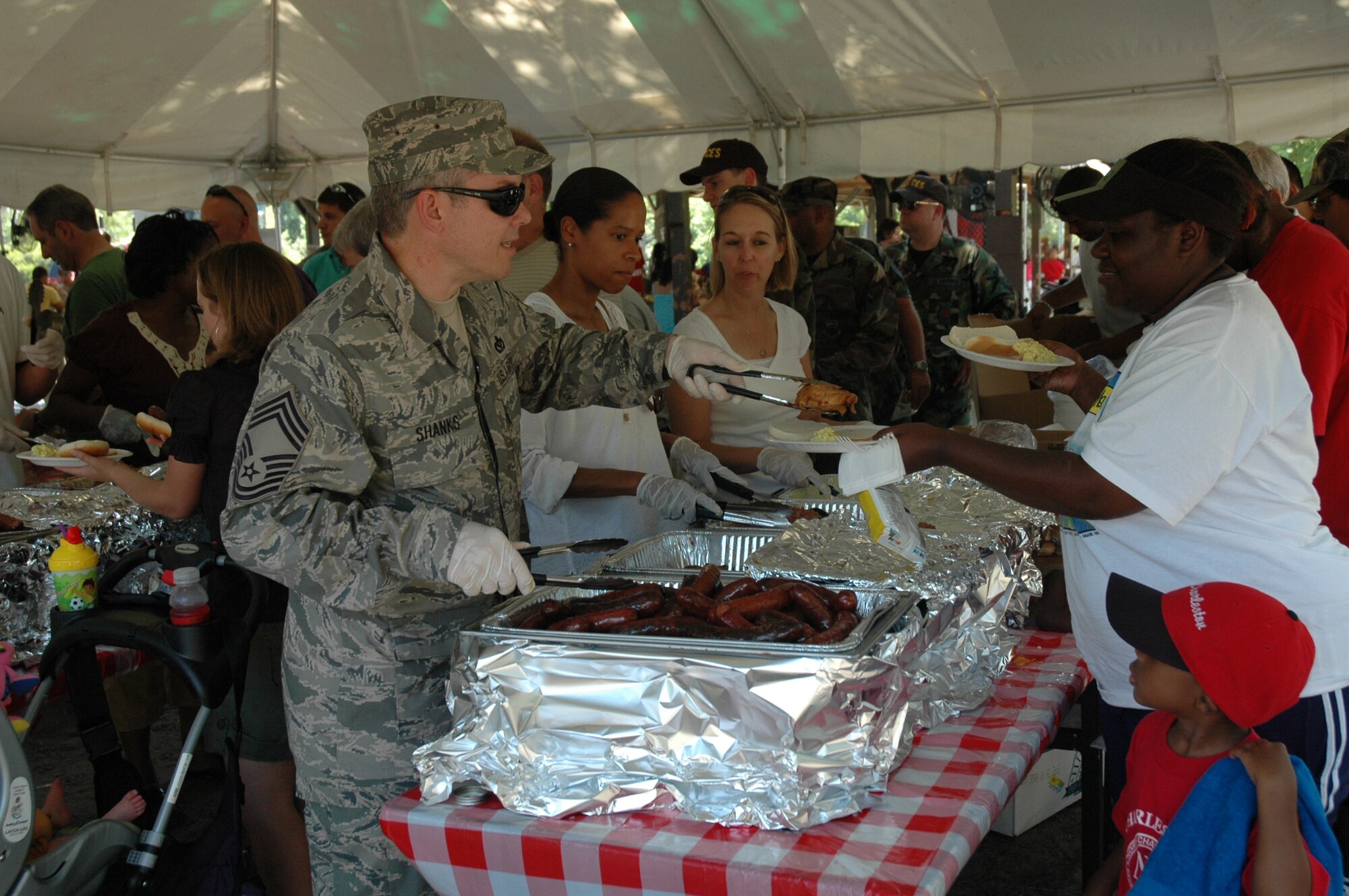 The annual 315th Airlift Wing base picnic was held at Charleston Air Force Base Saturday from 11 a.m. to 4 p.m. The event was a fun time for every member of the 315th reserve family with food for all, a boat load of cold beverages to help hold off the heat, and plenty of activities for the kiddies including: jump castles, a blow-up obstacle course, a twirling fair ride, face painting as well as playground equipment. Home Depot came out to support the troops and set up Do-It-Yourself craft tables where reservists and their children were able to build small projects together. Several reservists even brought out the family pet for the occasion.  (U.S. Air Force Photos by Senior Airman Dani Pacheco)