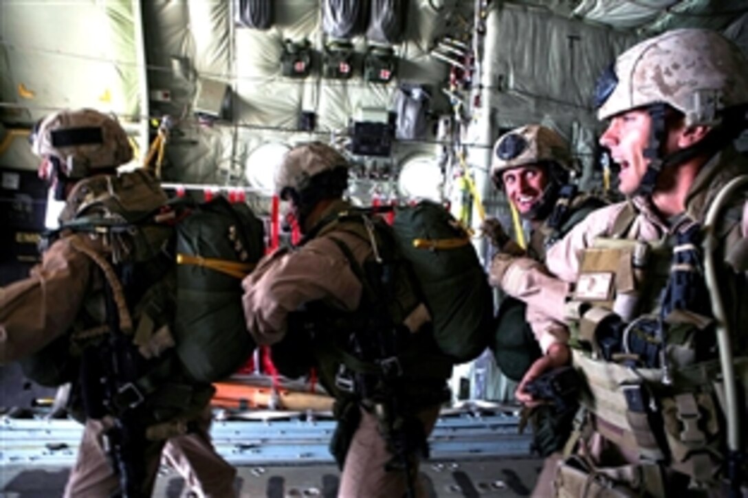 U.S. Marines prepare to jump from a KC-130J into Al Qa'im, Iraq on May 28, 2008. The Marines are  assigned to the 1st Marine Logistics Group, Combat Logistics Battalion-6, 3D Reconnaissance Battalion and CLB-6 and Marine Aerial Refueler Transport Squadron 352. They are conducing a logistical air delivery re-supply operation to deliver water and fuel to Al Qa'im, Iraq. 