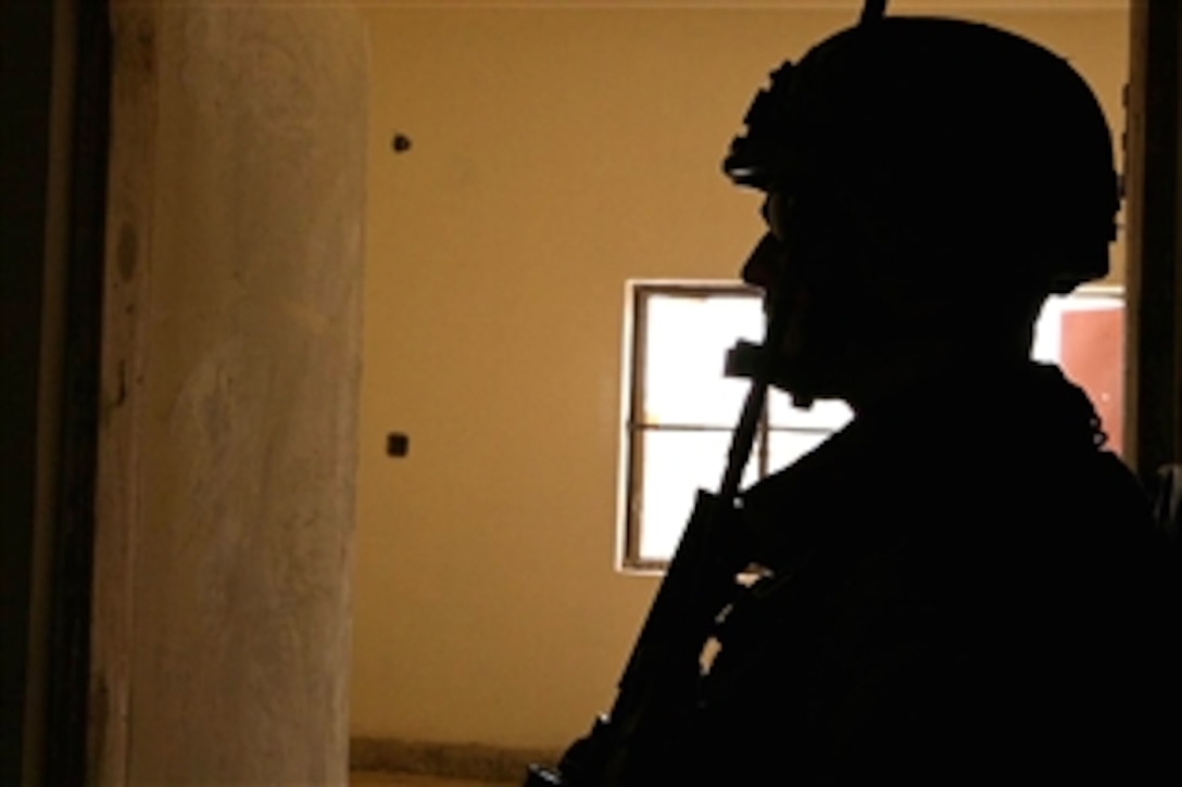 U.S. Marine Sgt. Daniel M. Matthew stands watch in an industrial high school currently under construction, where he is assessing reconstruction progress in Ramadi, Iraq, May 31, 2008. Matthews is assigned to the Civil Affairs Detachment 2, 2nd Battalion, 11th Marines, Regimental Combat Team 1. 