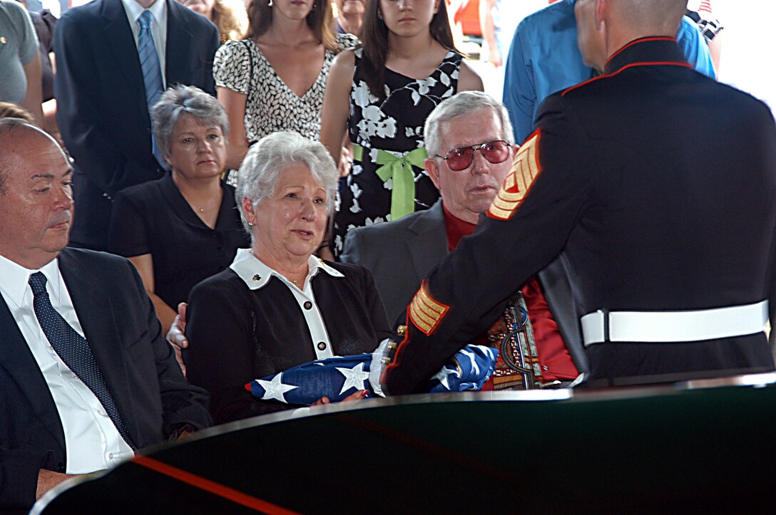 HATTIESBURG, Miss.- Ruby Lucas, widow of Medal of Honor recipient Jack Lucas, is comforted by friends and family during graveside services here June 9.  Hundreds gathered to say farewell to Jack Lucas, who enlisted in the Marine Corps at the age of 14 and later went on to receive the nation's highest military decoration at 17 for his actions on Iwo Jima. (Official photo by Gunnery Sgt. J.J. Connolly Jr.)