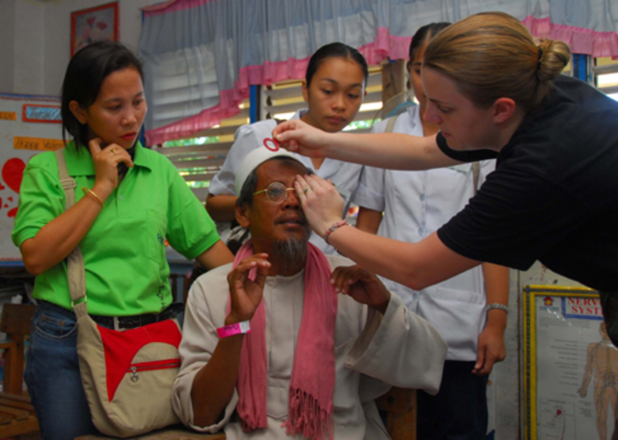 COTABATO, Philippines (June 03, 2008) – U.S. Air Force Senior Airman Kate Thomas assists a patient in finding a suitable pair of eye glasses during Pacific Partnership 2008.  Medical professionals from the Republic of the Philippines, Canada, Japan, and Australia are working side by side with American counterparts  providing medical, dental, veterinary and construction assistance programs.  (U.S. Navy photo by Mass Communication Specialist 3rd Class (SW/AW) Joshua Valcarcel) (RELEASED)