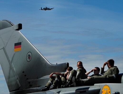 EIELSON AIR FORCE BASE, Alaska -- German crew chiefs watch as an A-10 Thunderbolt II flies over the Eielson flightline during Red Flag-Alaska 08-3 June 9. Each Red Flag-Alaska often involves units whose missions may differ significantly from that of other participating units. (U.S. Air Force photo by Airman 1st Class Christopher Griffin)