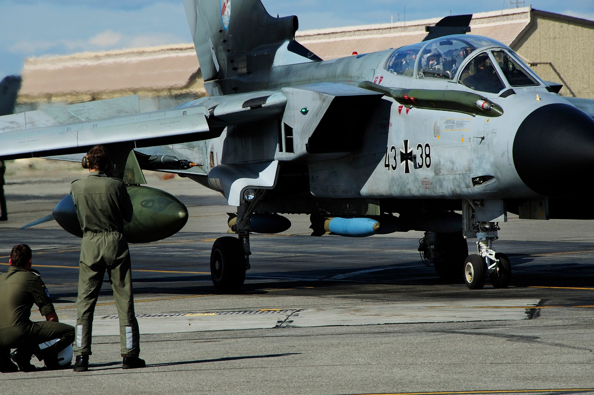EIELSON AIR FORCE BASE, Alaska --Two German crew chiefs stand by watching as a Tornado prepares to takeoff
and participate in a training exercise during RED FLAG-Alaska 08-3 June 9, 2008. Each RED FLAG-Alaska exercises often involve several units whose military mission may differ significantly from that of other participating units.  (U.S. Air Force photo by Airman 1st Class Christopher Griffin) 
