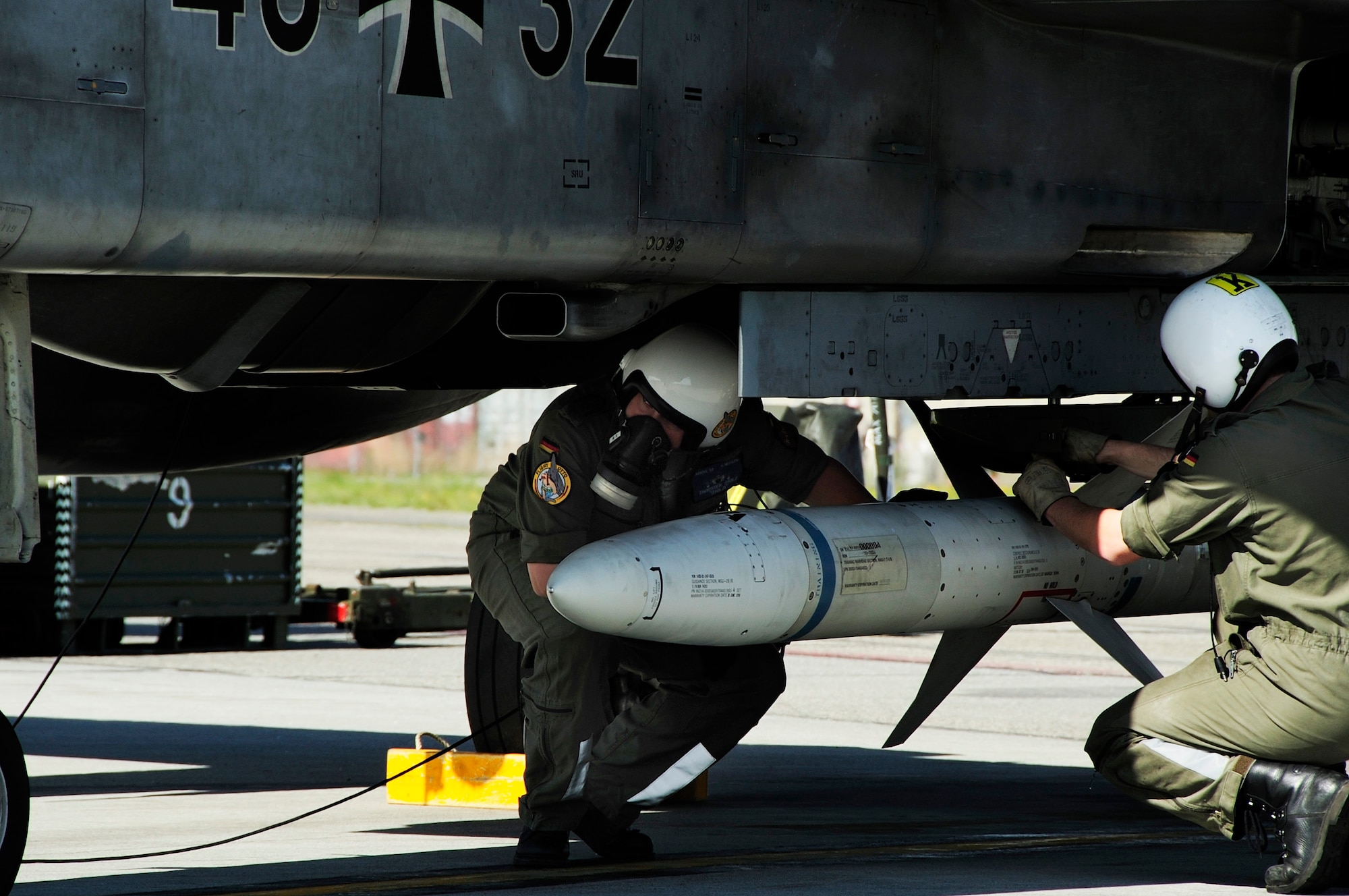 EIELSON AIR FORCE BASE, Alaska --Two German crew chiefs prepare a Tornado for takeoff to participate in RED
FLAG-Alaska 08-3 June 9, 2008 at Eielson AFB, Alaska. Red Flag-Alaska is a series of Pacific Air Forces commander-directed field training exercises for U.S. forces, provides joint offensive counter-air, interdiction, close air
support, and large force employment training in a simulated combat environment.   (U.S. Air Force photo by Airman 1st Class Christopher Griffin) 