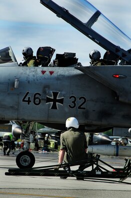 EIELSON AIR FORCE BASE, Alaska --Two German Air Force pilots go through a pre-flight inspection here June 9. The Germans are participating in Red Flag-Alaska 08-3, a 10-day air combat training exercise held up to four times a year over Alaskan and Western Canadian airspace. (U.S. Air Force photo by Airman 1st Class Christopher Griffin)
