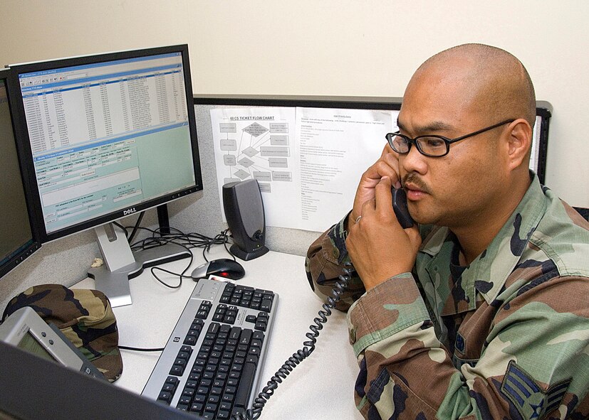 Local Time 7:38   Zulu time 14:38 Senior Airman Eddie Nisperos, a Network Infrastructure Technician, helps a customer  by phone to trouble shoot a computer network problem from the Help Desk. SrA Nisperos helps assist over  50 customers a day. He is a member of the 60th Communications Squadron at Travis Air Force Base, California. 