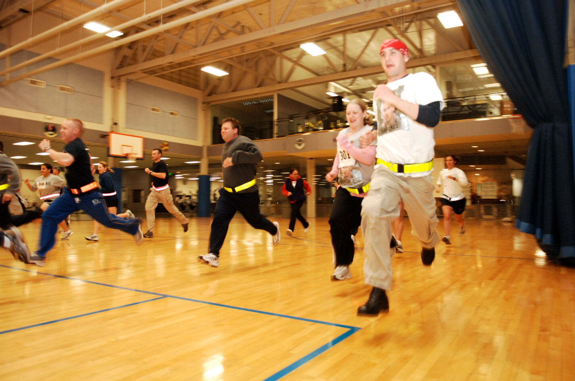 FAIRCHILD AIR FORCE BASE, Wash. – Teams race off the line at the Fitness Center gymnasium June 6, marking the first event in the Great Race, a 12-hour Services-sponsored event, which kicked off at midnight and lasted until noon the following day. (U.S. Air Force photo / Staff Sgt. Chad Watkins)