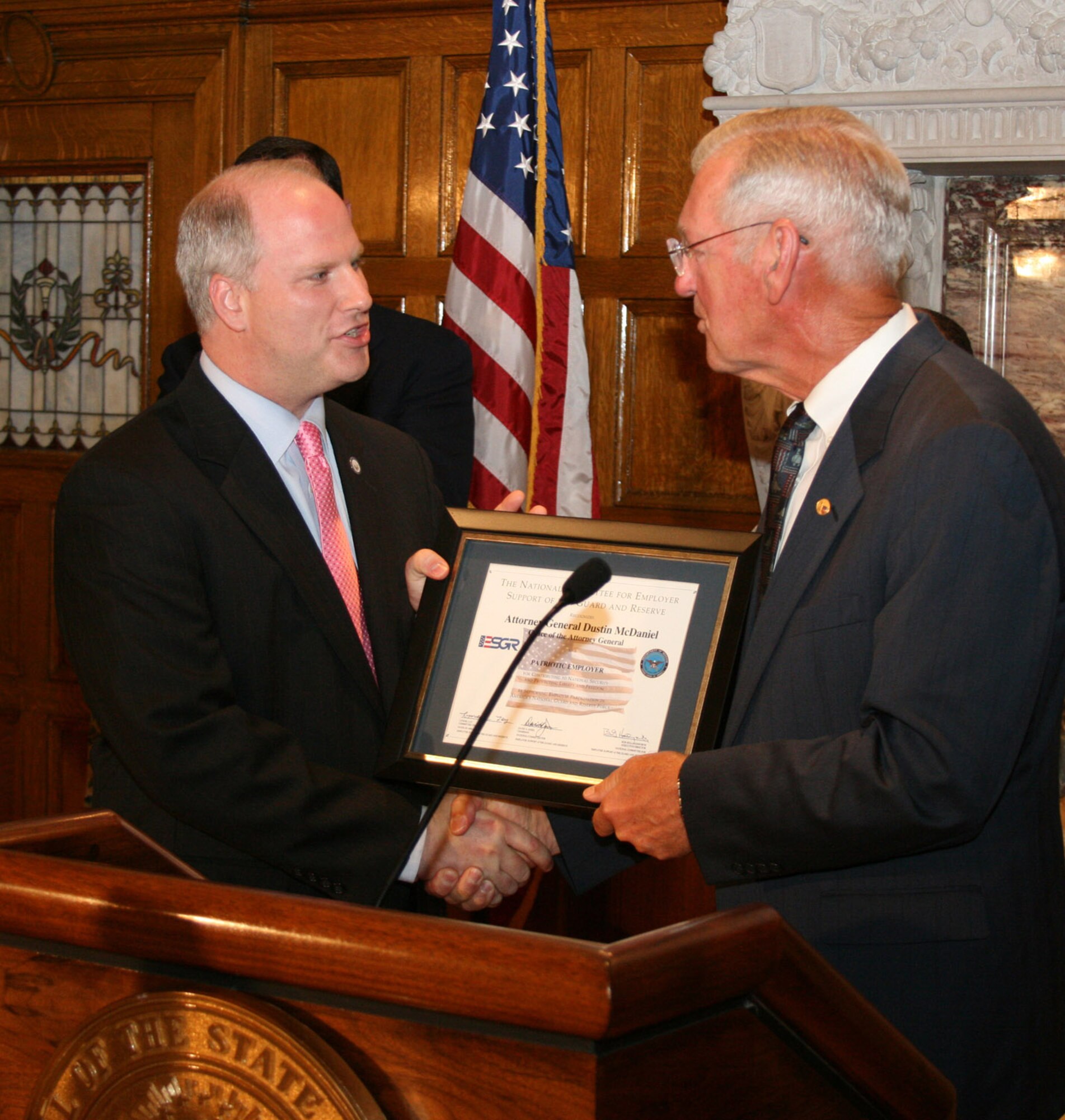 Arkansas Attorney General Dustin McDaniel accepts an Employer Support of the Guard and Reserve award from State ESGR Chairman and retired Maj. Gen. Don C. Morrow. (U.S. Air Force photo by Master Sgt. Bob Oldham)