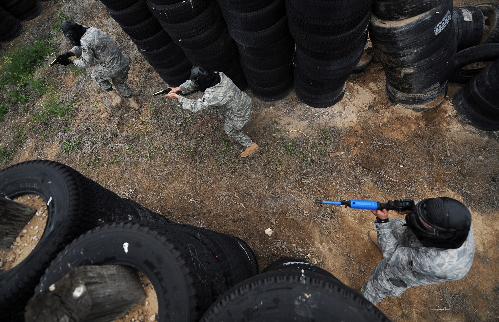MOUNTAIN HOME AIR FORCE BASE, Idaho - Airman 1st Class Jonathan White, 366th Security Forces Squadron patrolman, lays down suppressing fire to allow his squad members to rush in and clear the room of hostile forces June 4. The 366th SFS gives its members hands-on training in scenarios they may run into while in a deployed environment. (U.S. Air Force photo/ Airman 1st Class Ryan Crane)