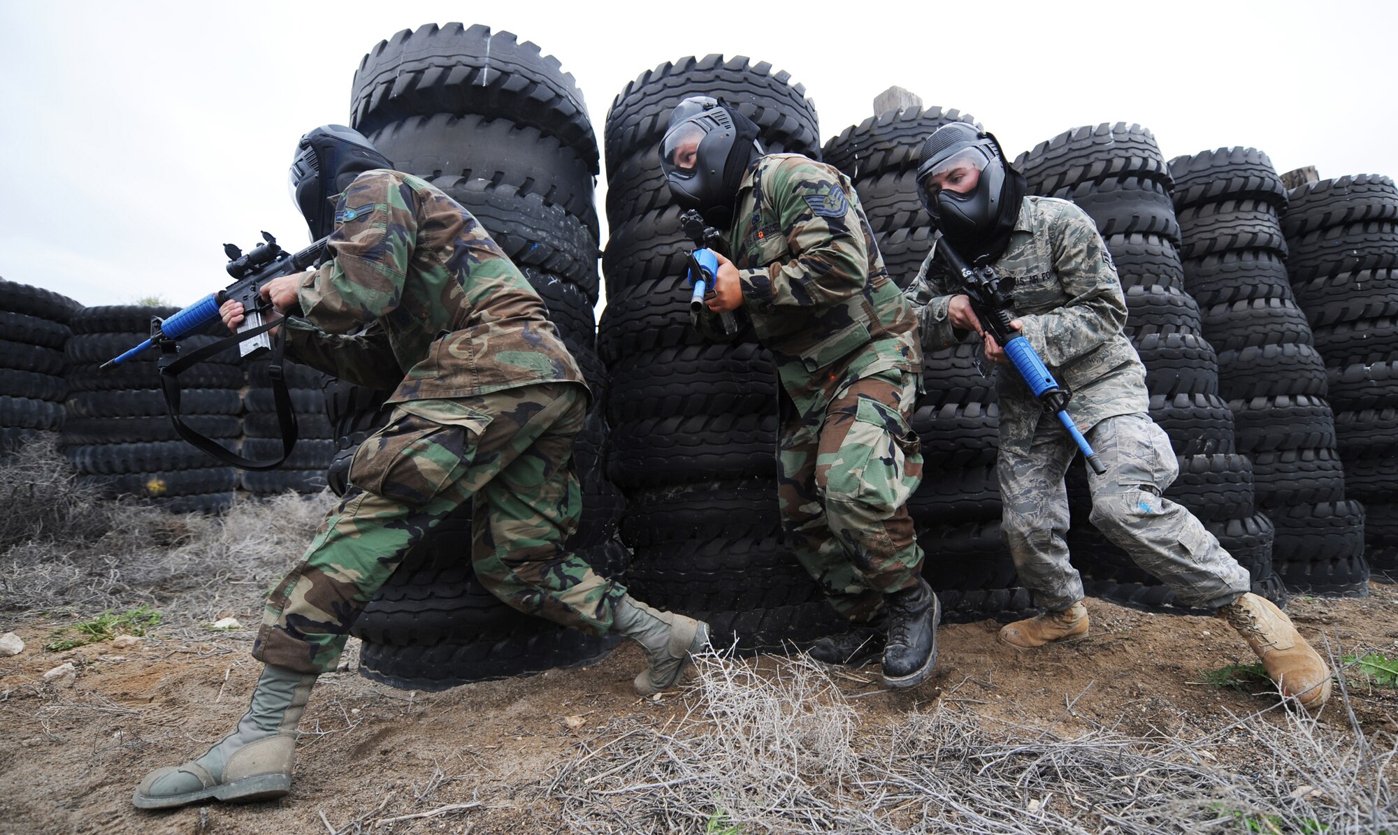 MOUNTAIN HOME AIR FORCE BASE, Idaho - (left to right) Airman 1st Class Travis Oswald, 366th Security Forces Squadron Patrolman, leads his squad made up of Tech. Sgt. Jeremiah Andrus and Airman 1st Class Jonathan White, 366th SFS patrolmen, into the next room, clearing it of hostile forces June 4. The 366th SFS gives its members hands-on training in scenarios they may run into while in a deployed environment. (U.S. Air Force photo/ Airman 1st Class Ryan Crane)