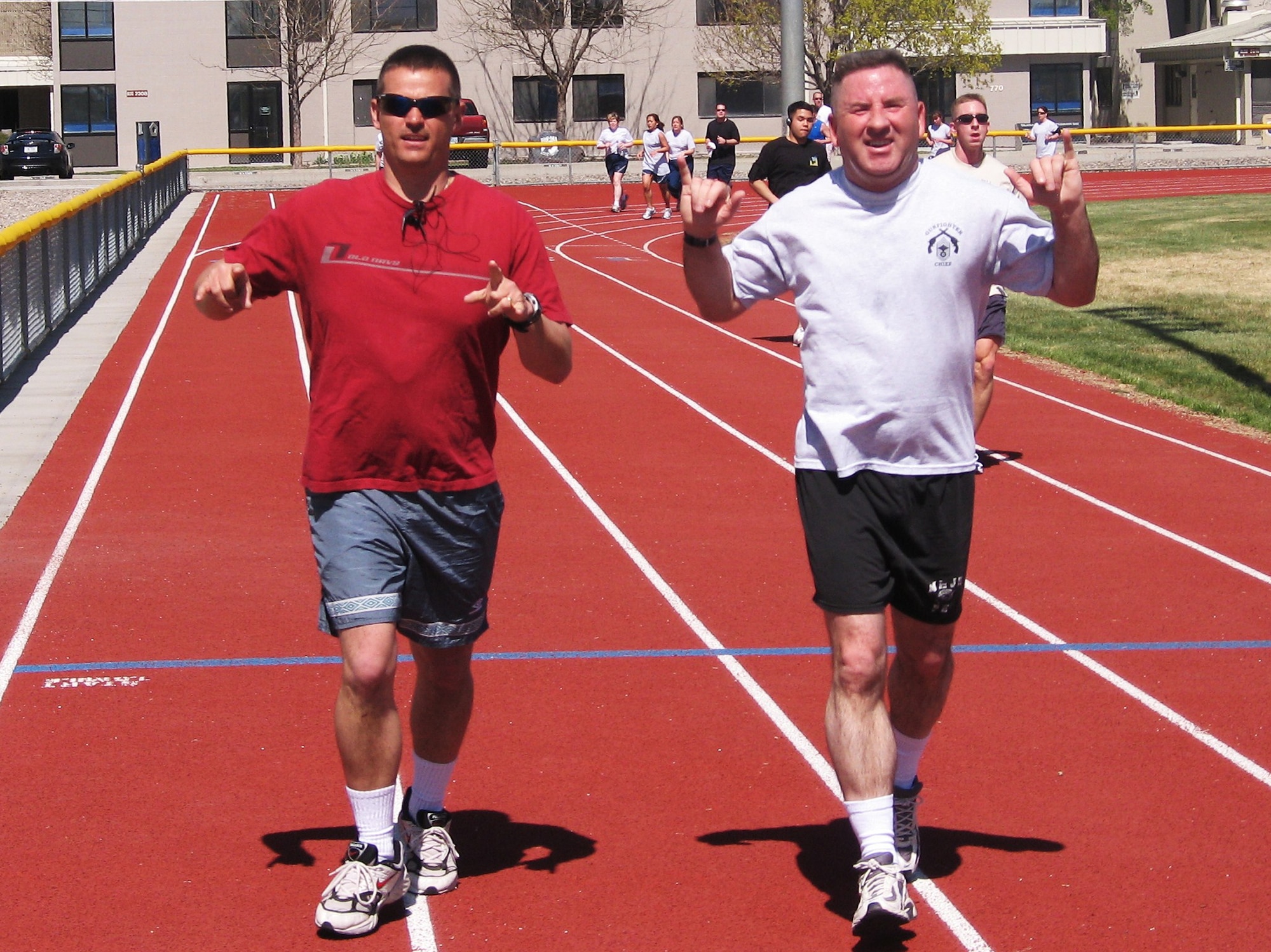 MOUNTAIN HOME AIR FORCE BASE, Idaho -- Left, Master Sgt. Robert Woodin, 366th Civil Engineer Squadron first sergeant, and Chief Master Sgt. Allen Niksich, 366th Fighter Wing command chief, complete another lap during the Mountain Home Air Force Base Top 3 Run-A-Thon at the base fitness center May 2 to raise funds for various charities. More than 85 people joined the run with more than $9,000 raised for numerous charities. (U.S. Air Force photo/Master Sgt. Bruce Perkins)